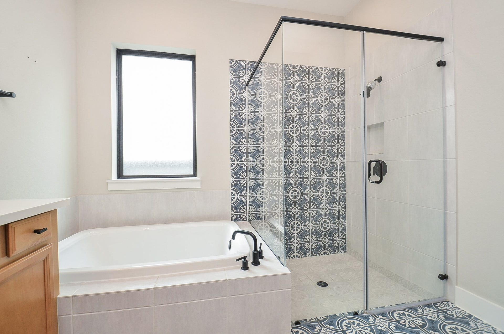15814 Celebration Lane, Cypress, TX 77433 Spa-inspired bathing area features a soaking tub and separate glass-enclosed shower.