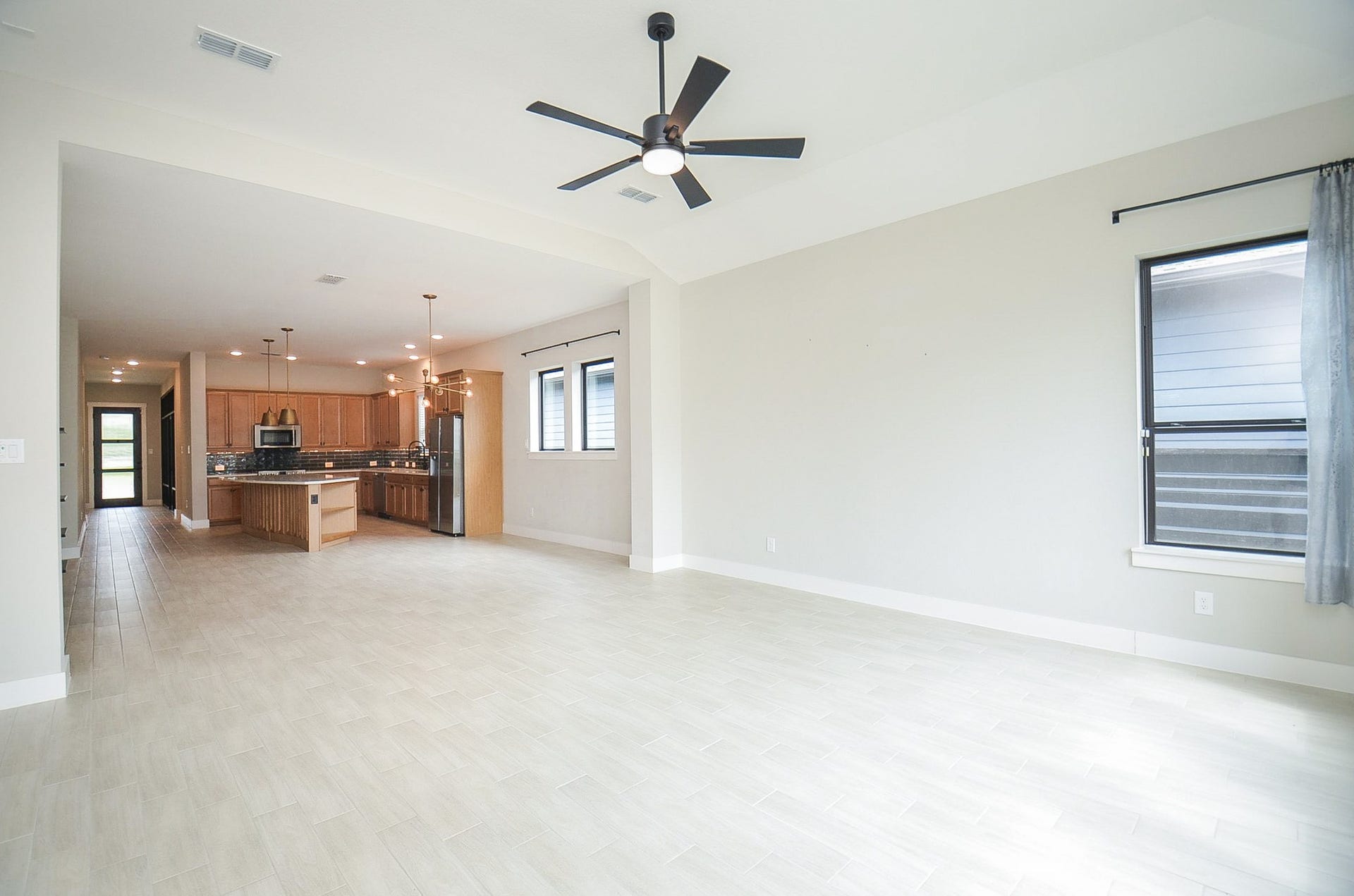 15814 Celebration Lane, Cypress, TX 77433 Expansive open living area with seamless flow into the kitchen.