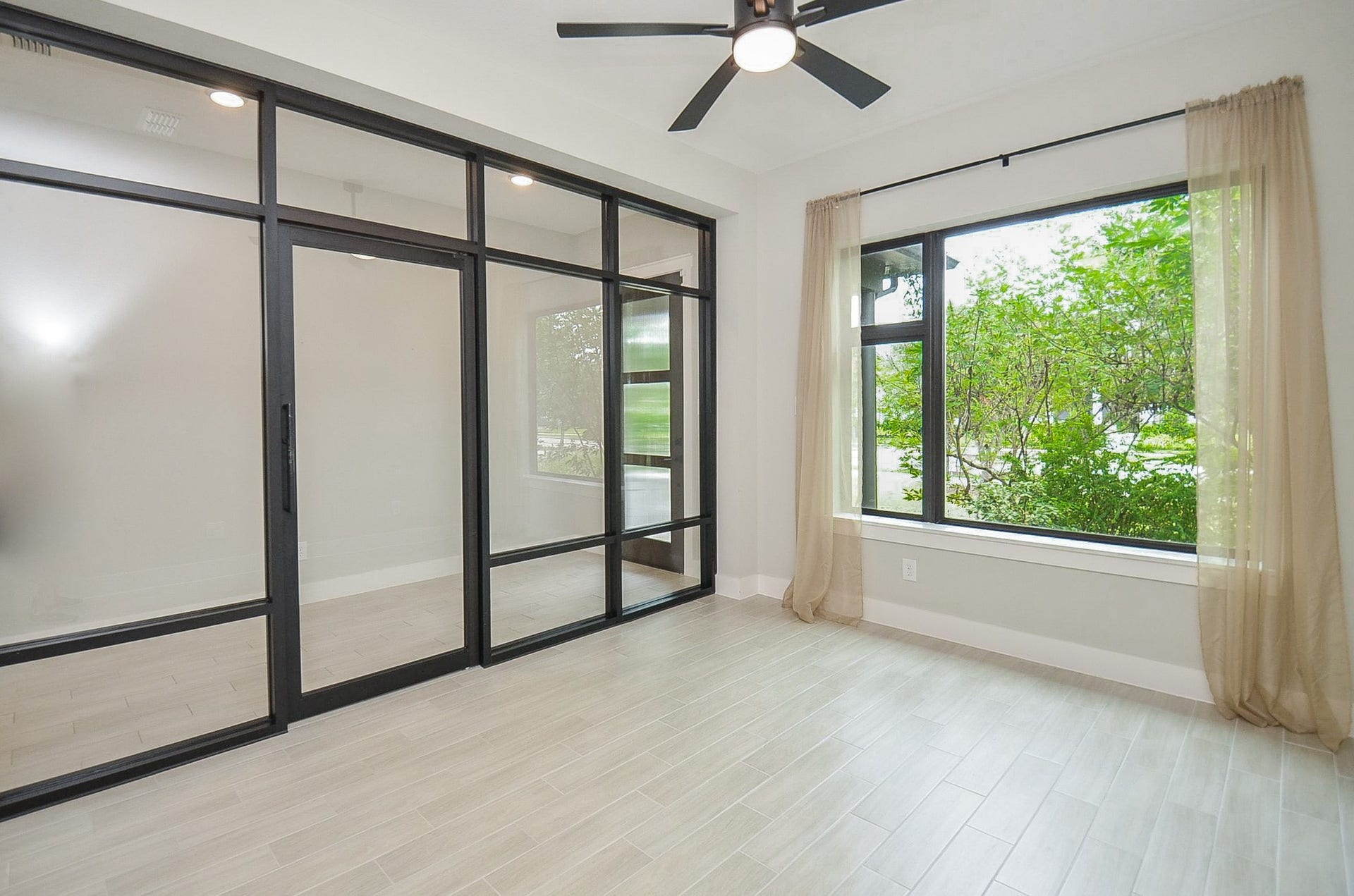 15814 Celebration Lane, Cypress, TX 77433 Sun-filled flex room offers versatile space for a home office, lounge or creative retreat.