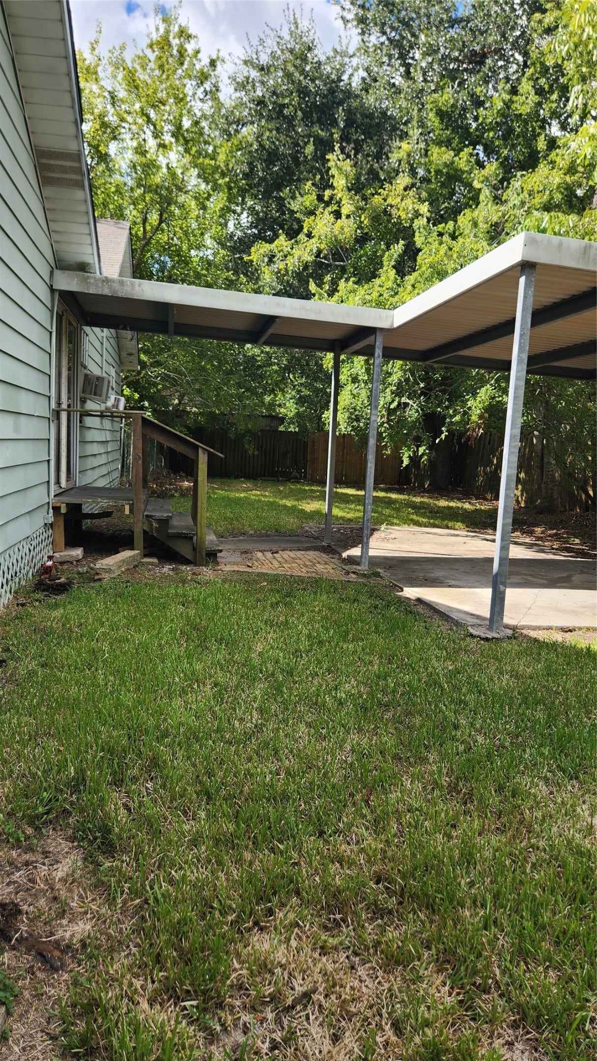 7102 Stewart Street, Hitchcock, TX 77563 covered porch with access via back patio.