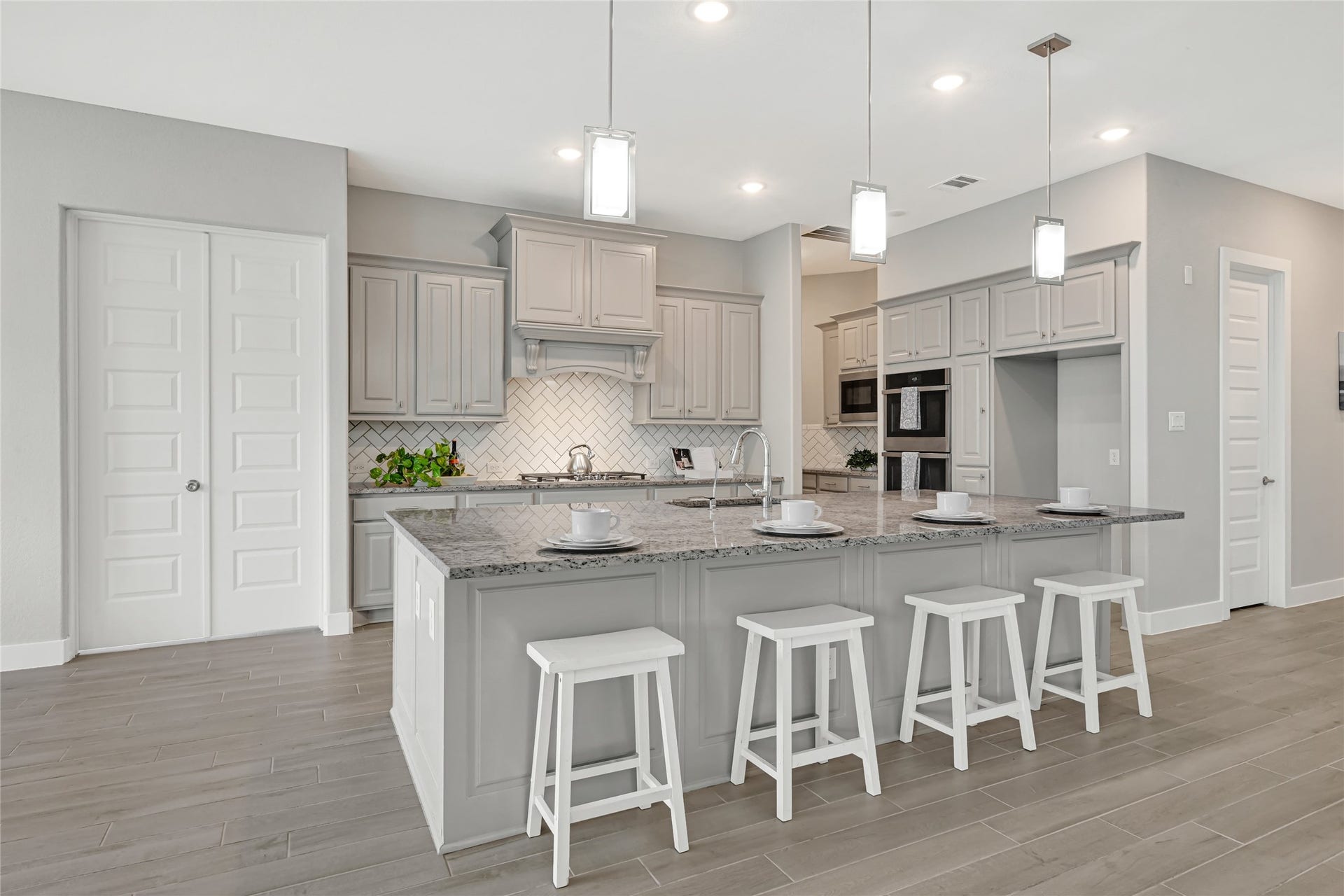 10315 Fountain Shore Drive, Missouri City, TX 77459 Gourmet main kitchen with large island, ample cabinetry , Upgraded double ovens open layout, Coffee Nook on the side