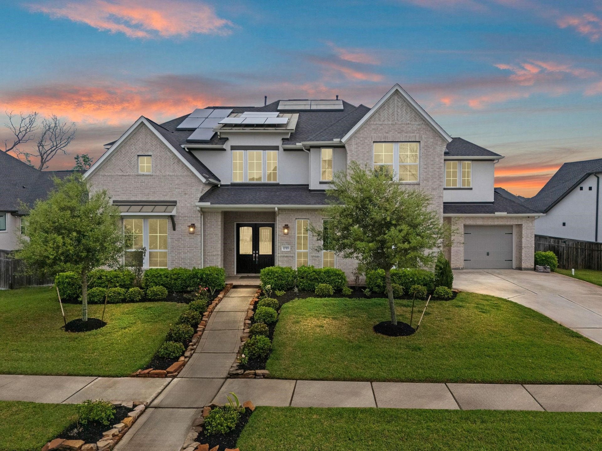 10315 Fountain Shore Drive, Missouri City, TX 77459 Stunning stucco and Brick elevation with Grand double door entry , and 3 car garage