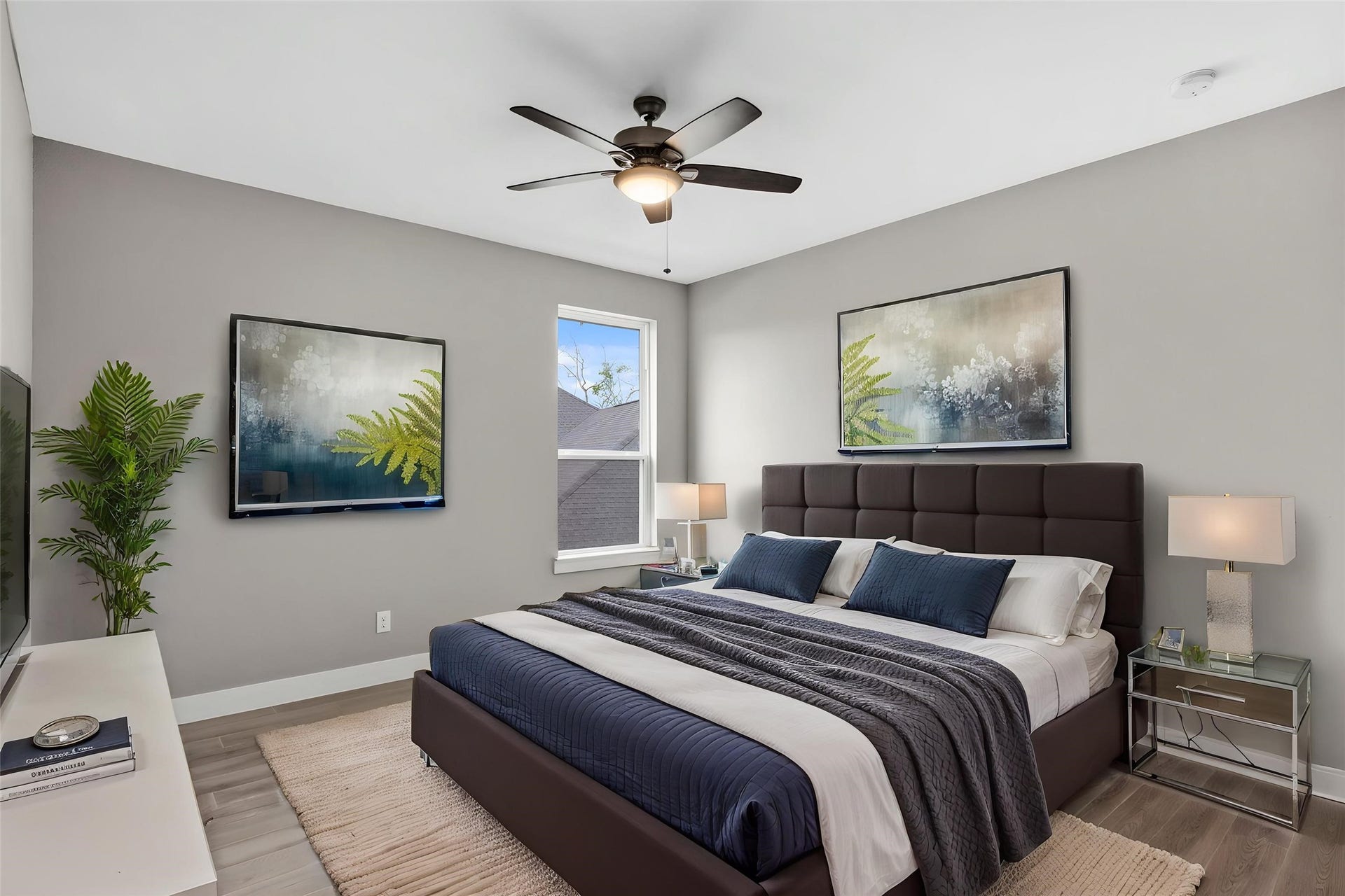 10315 Fountain Shore Drive, Missouri City, TX 77459 Spacious secondary bedroom with large windows and ceiling fan.