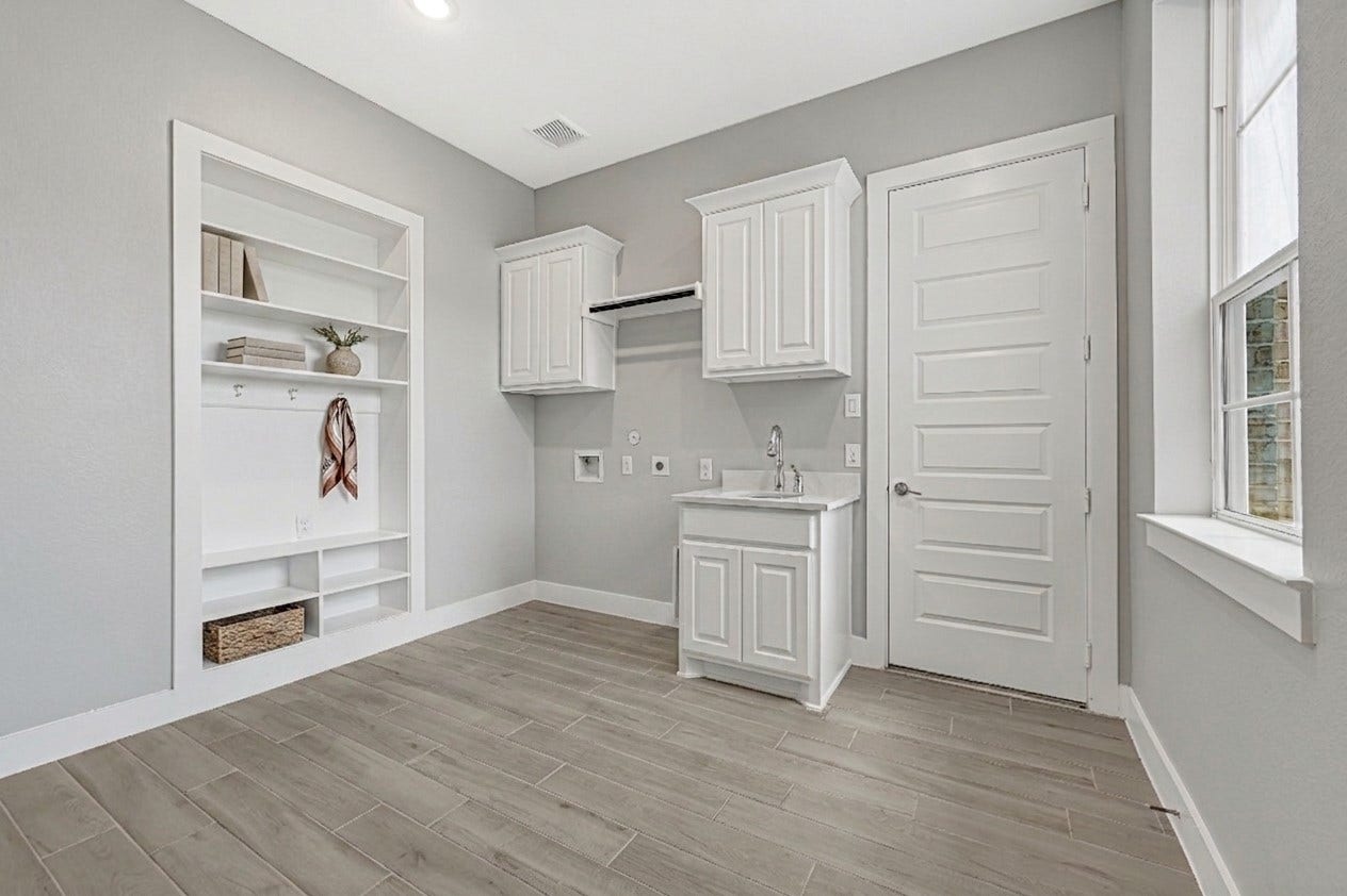 10315 Fountain Shore Drive, Missouri City, TX 77459 Laundry room with additional sink and upgraded cabinets