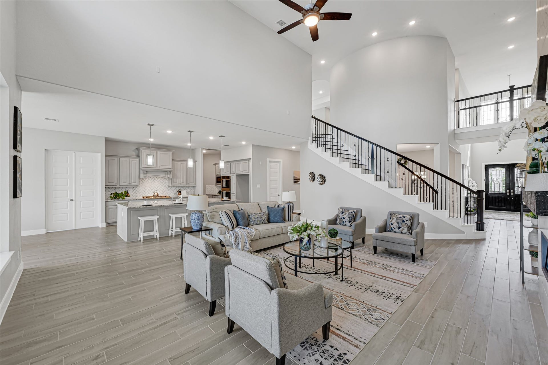 10315 Fountain Shore Drive, Missouri City, TX 77459 Open-concept living space connecting the kitchen, dining and family areas.