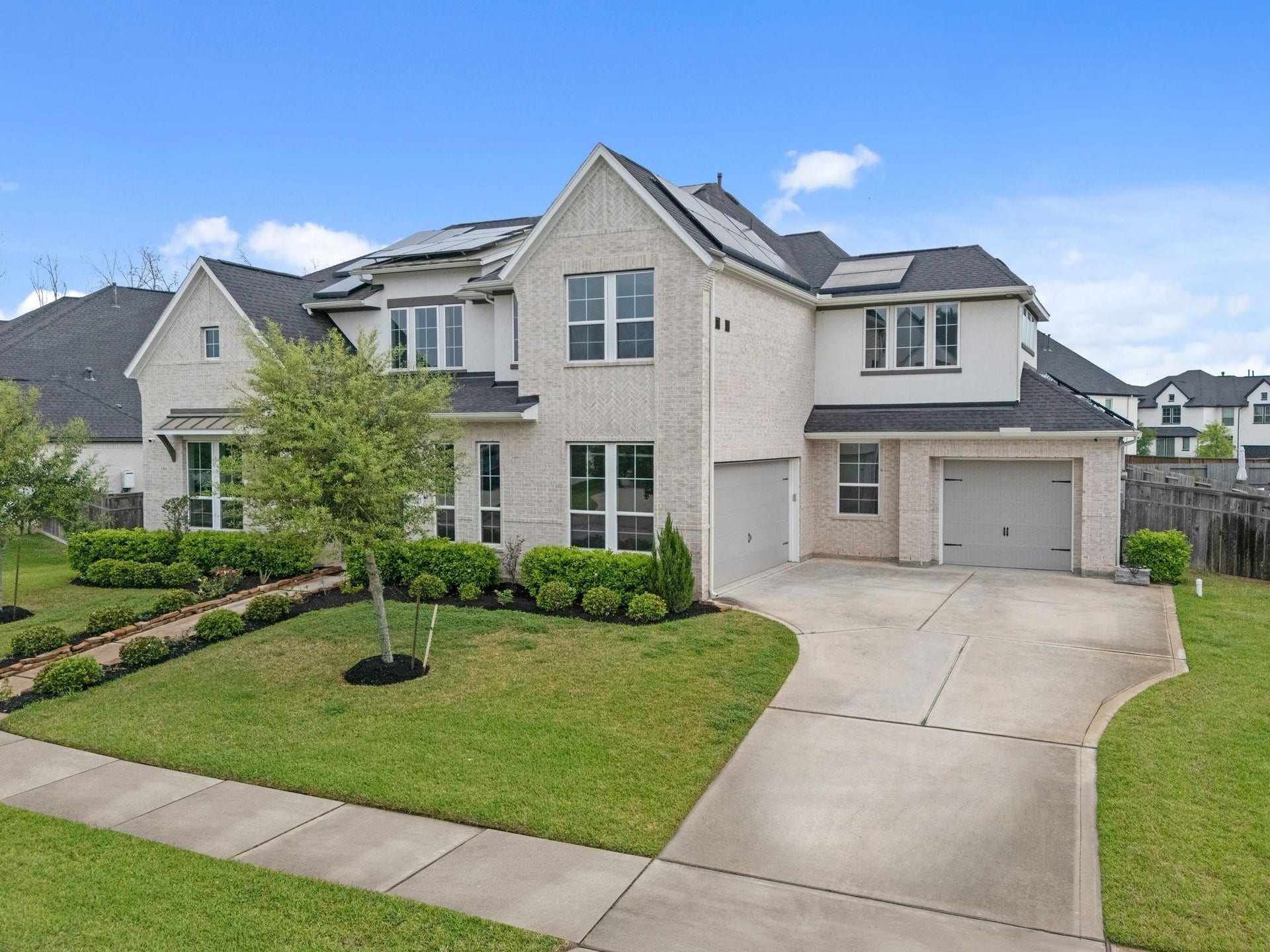 10315 Fountain Shore Drive, Missouri City, TX 77459 Impressive front exterior showcasing the home's grand architecture.