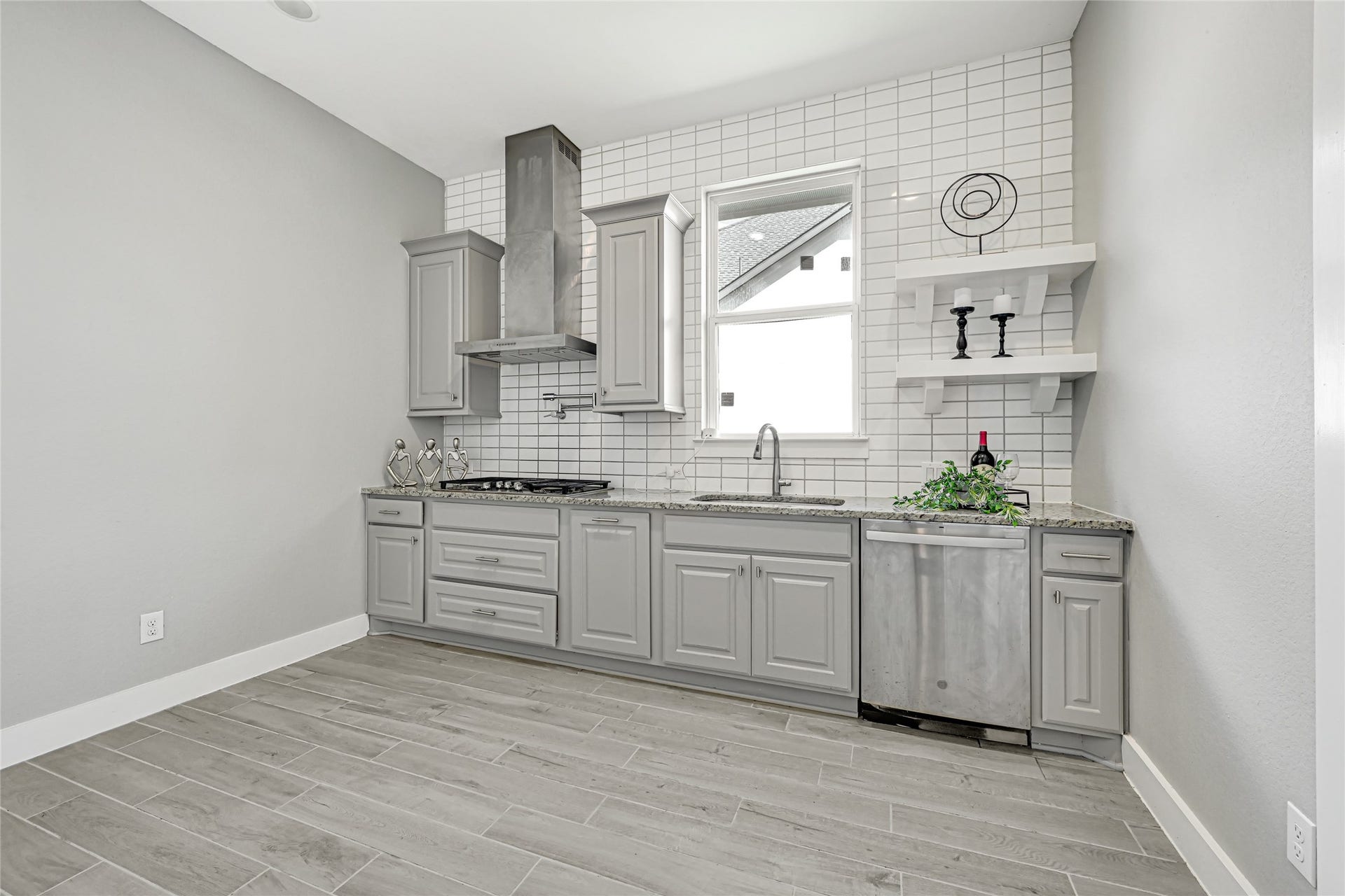 10315 Fountain Shore Drive, Missouri City, TX 77459 Secondary kitchen/spice kitchen with cabinetry and functional workspace. The kitchen has a full blown pantry