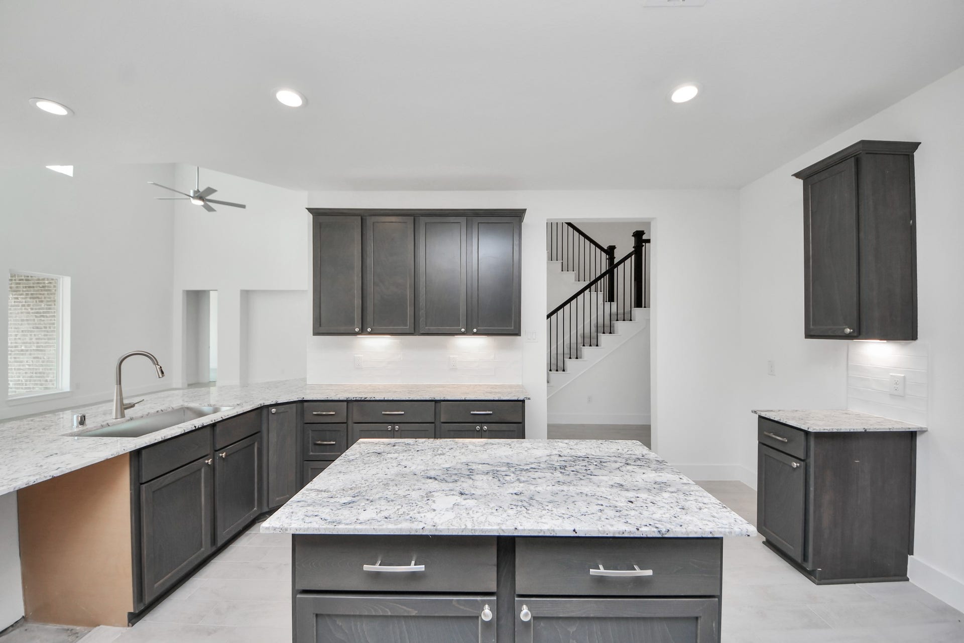 All of this overlooks your expansive family room, creating a perfect space for culinary delights and family gatherings.