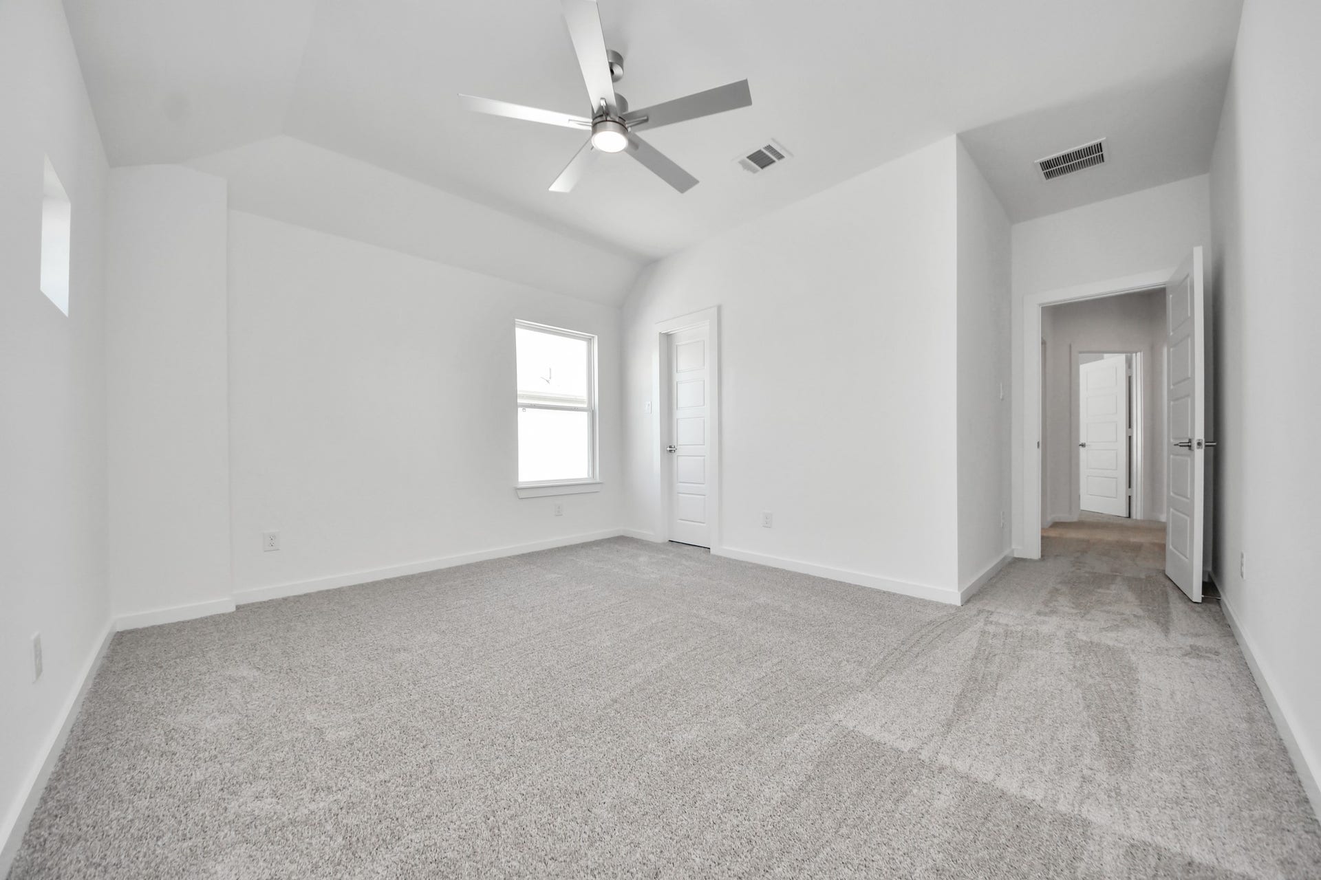 Generously sized secondary bedrooms featuring spacious closets, soft and inviting carpeting underfoot, large windows allowing plenty of natural light, and the added touch of privacy blinds for your personal retreat.