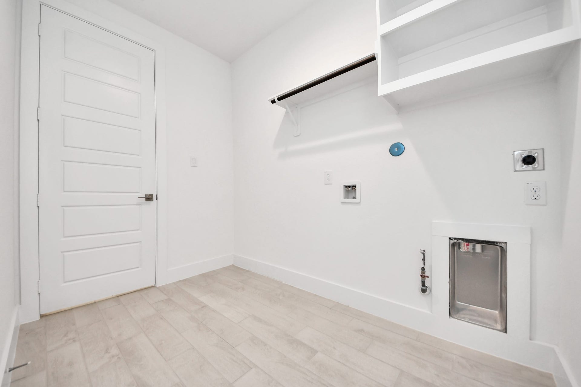 A perfect blend of functionality and comfort. Capture the essence of easy living with a first-floor laundry room, thoughtfully equipped with shelving for effortless organization. Both electric and gas connections available.