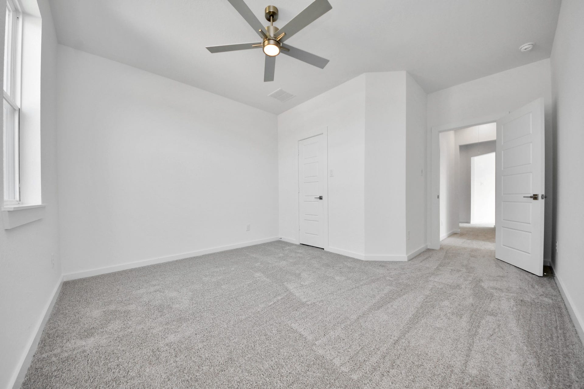 Generously sized secondary bedrooms featuring spacious closets, soft and inviting carpeting underfoot, large windows allowing plenty of natural light, and the added touch of privacy blinds for your personal retreat.
