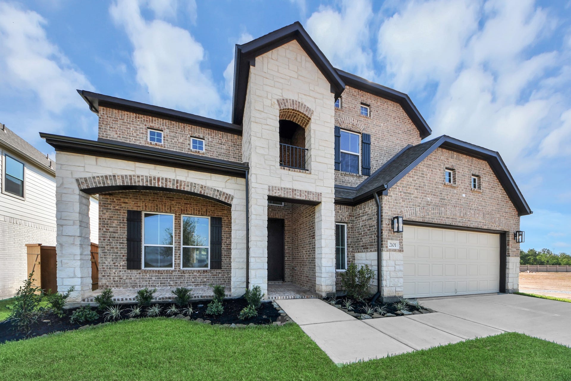Home features a convenient 2-car garage complemented by a spacious driveway, offering ample parking for you and your guests.