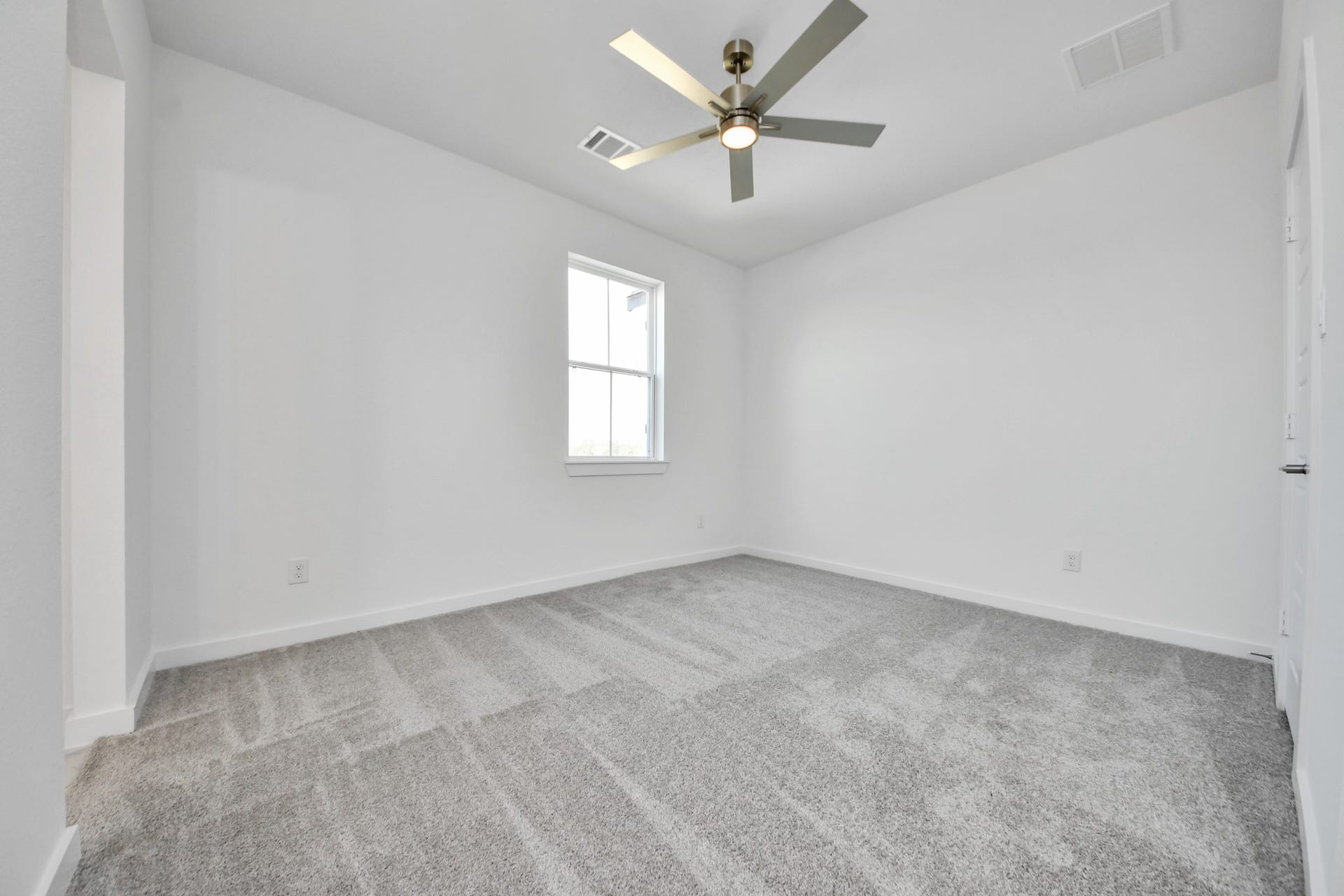 Generously sized secondary bedrooms featuring spacious closets, soft and inviting carpeting underfoot, large windows allowing plenty of natural light, and the added touch of privacy blinds for your personal retreat.