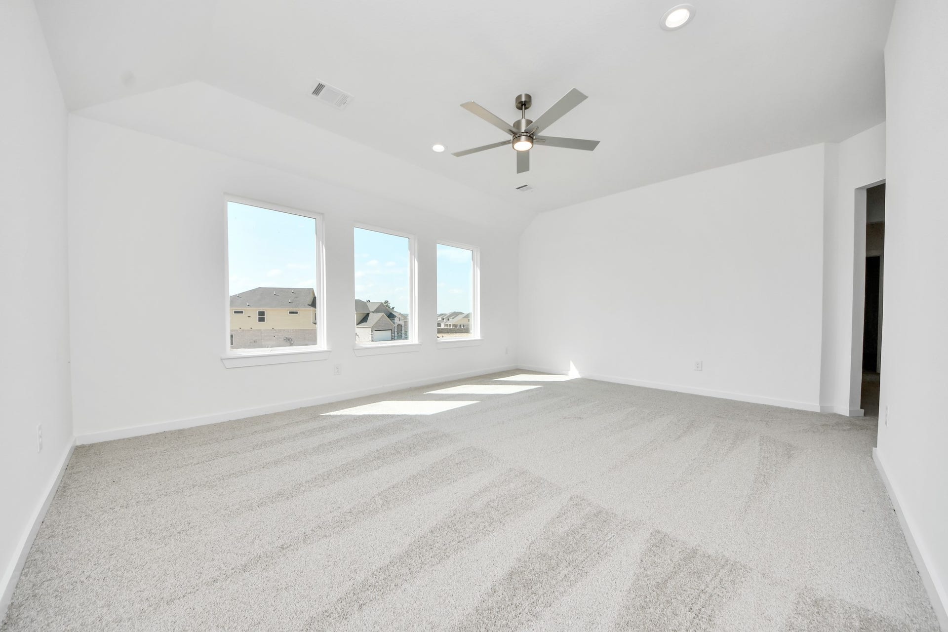 Come upstairs and enjoy a day of leisure in this fabulous game room! This is the perfect hangout spot or adult game room! Features plush carpet, high ceilings, custom paint and windows for plenty of natural light.