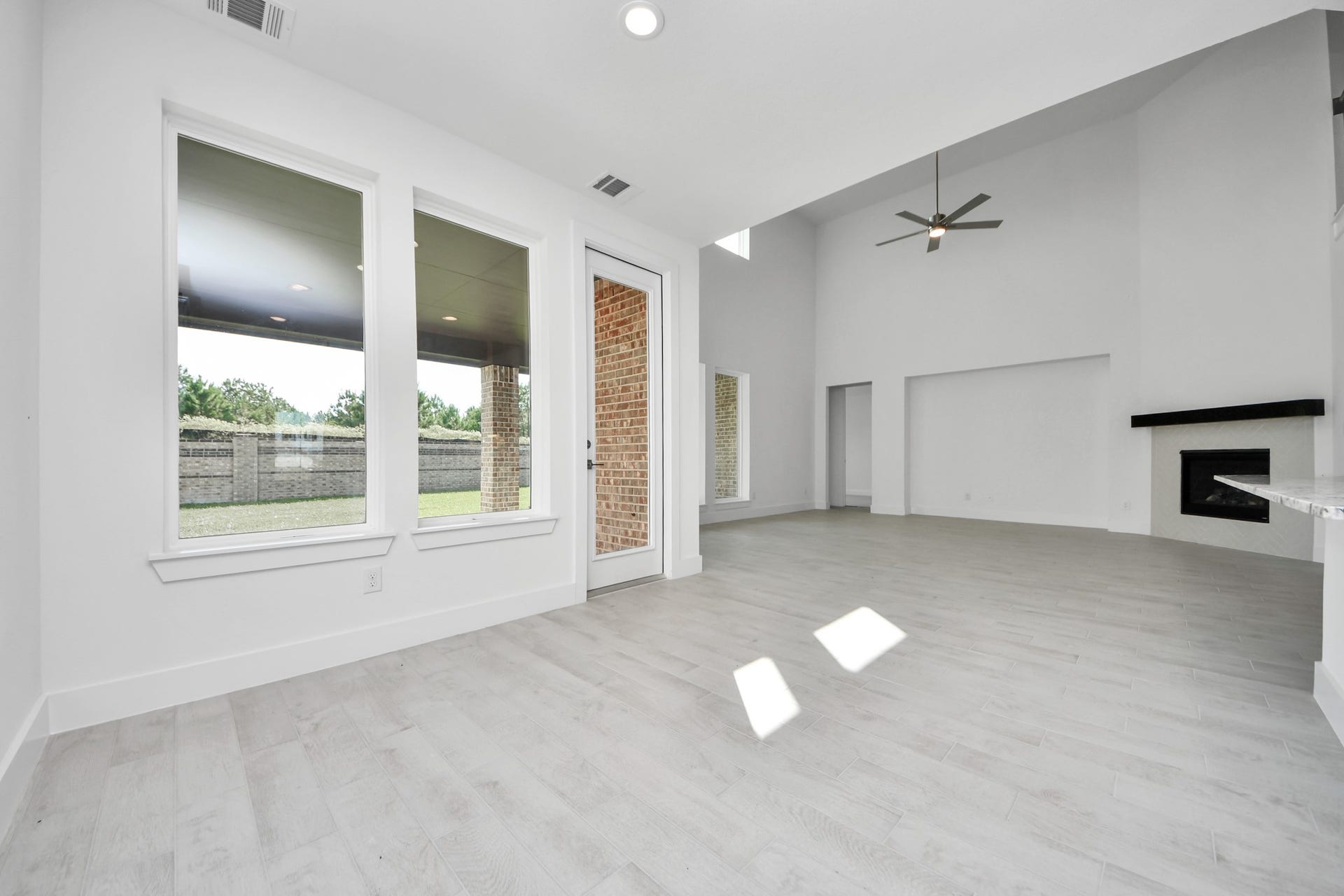 Enjoy breakfast with ease in the connected and cozy breakfast area, seamlessly integrated with the kitchen for utmost convenience. Step through the back door for a breath of fresh air onto the covered patio, extending your living space to the outdoors