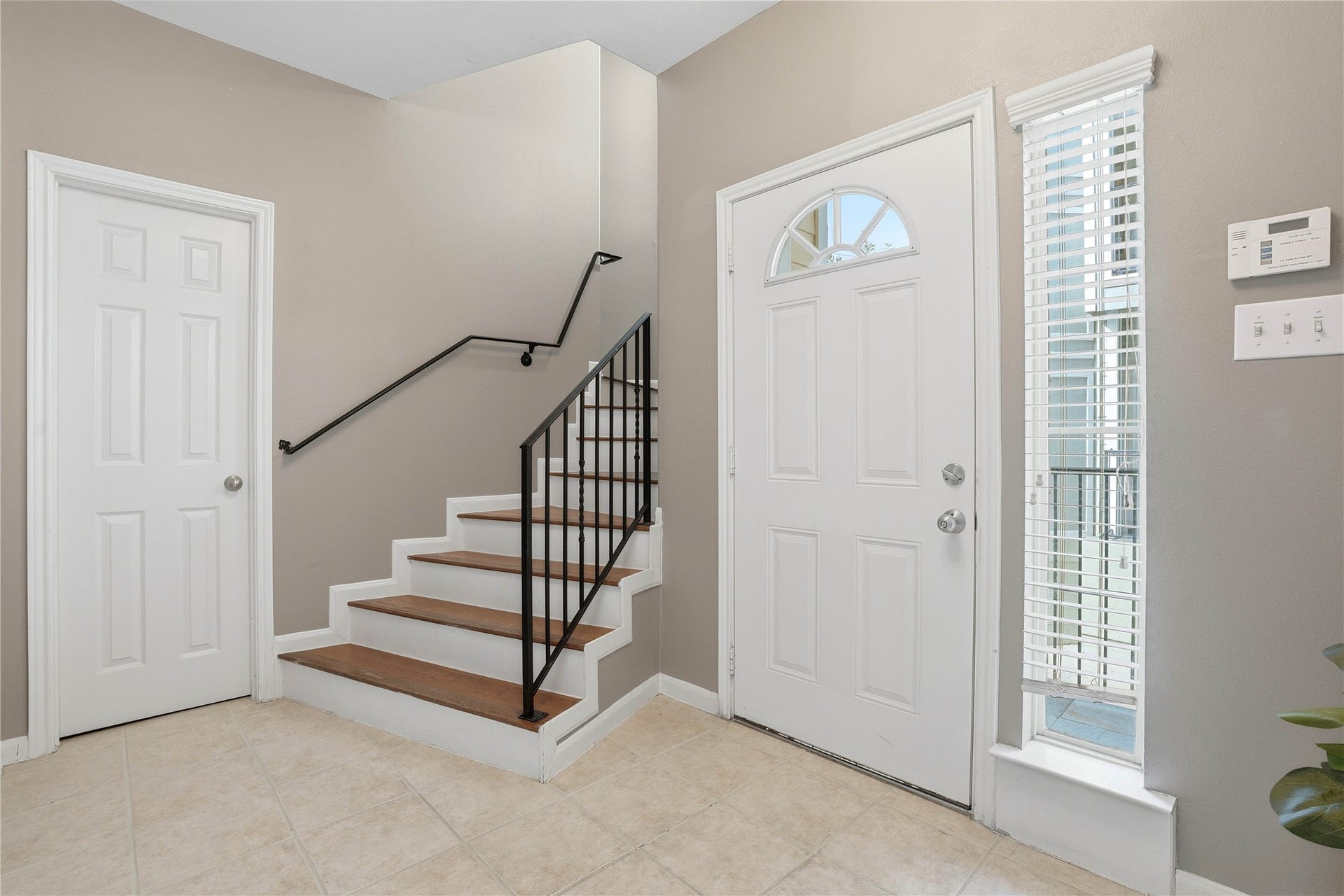 Private entry way with storage room and bedroom on first leve