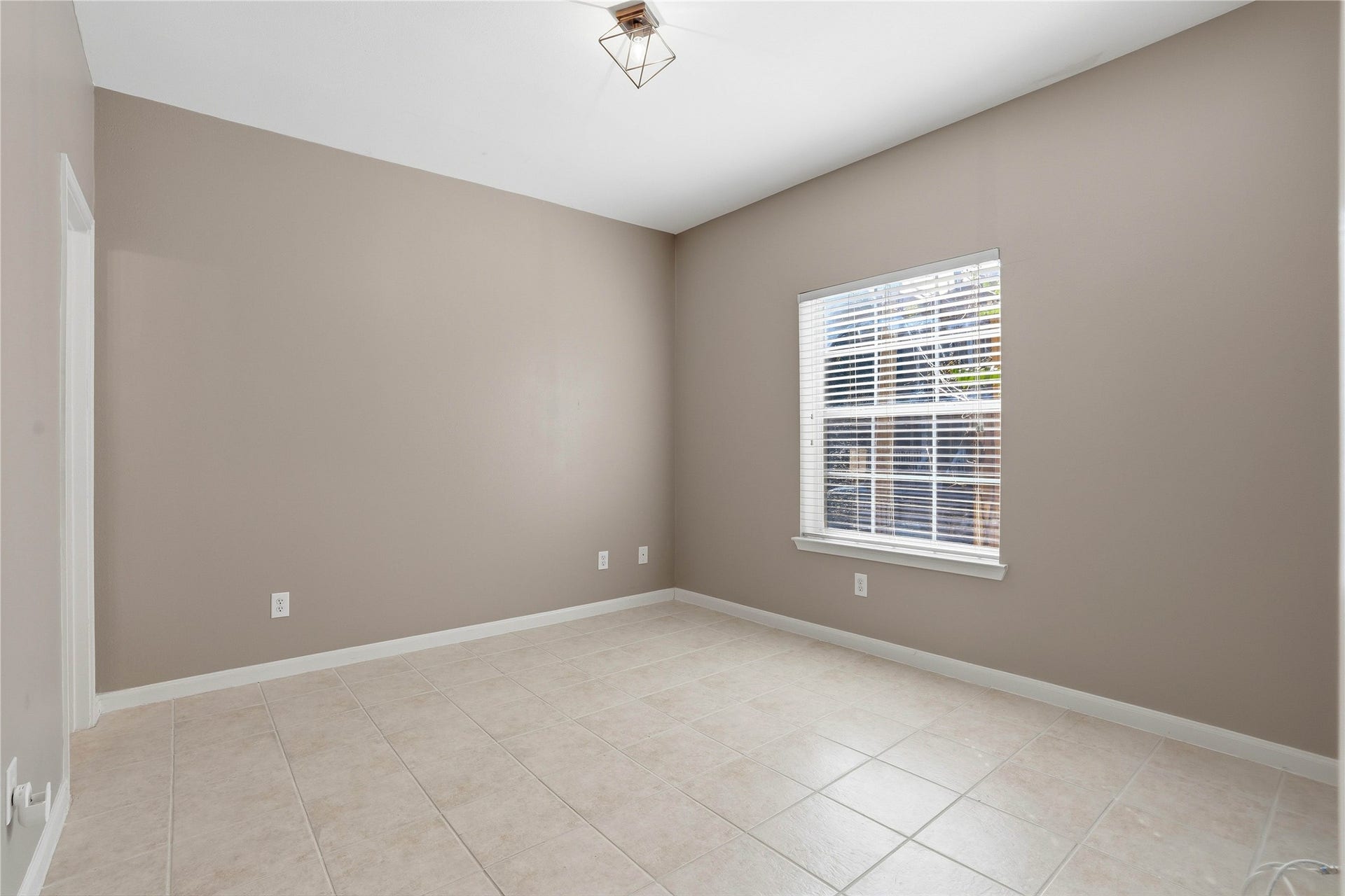 First floor bedroom with window facing the street