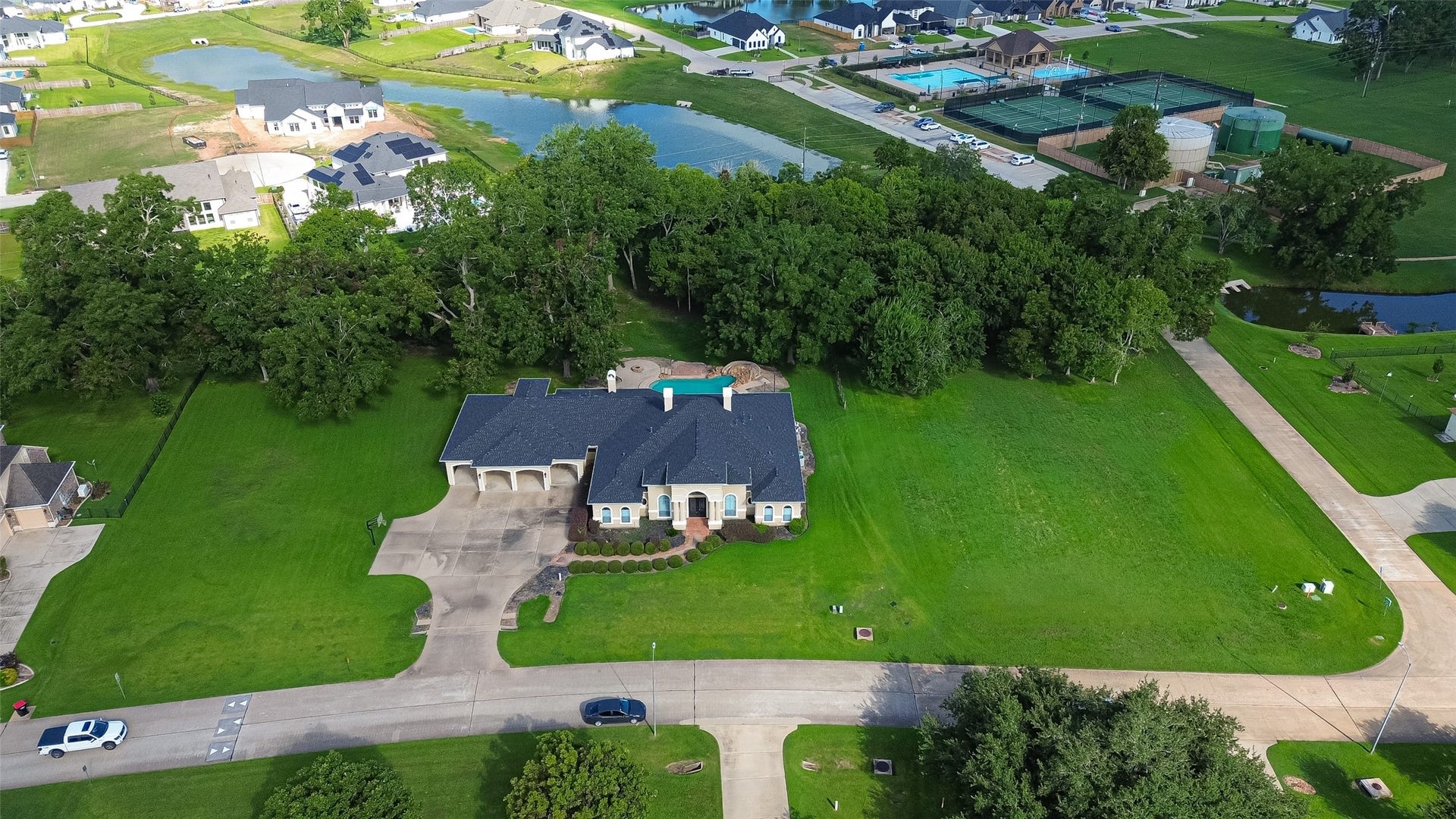 4011 Westerdale Drive, Fulshear, TX 77441 Notice in the top left corner of the picture. The neighborhood pool and tennis courts are walking distance away.