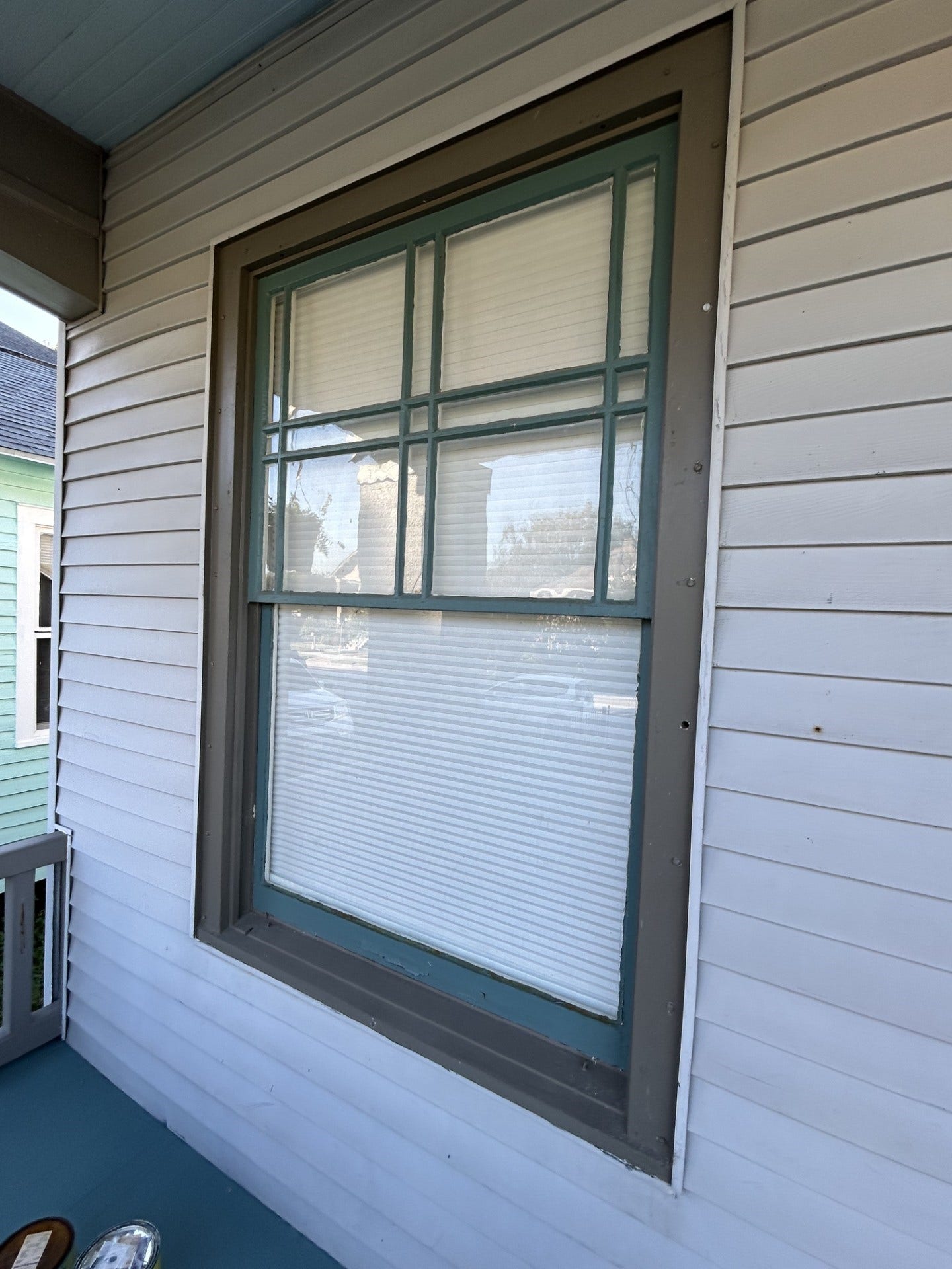 3911 Bernardo De Galvez Avenue, Galveston, TX 77550 Craftsman-style front window with the detailed upper sash and the lone lower sash.