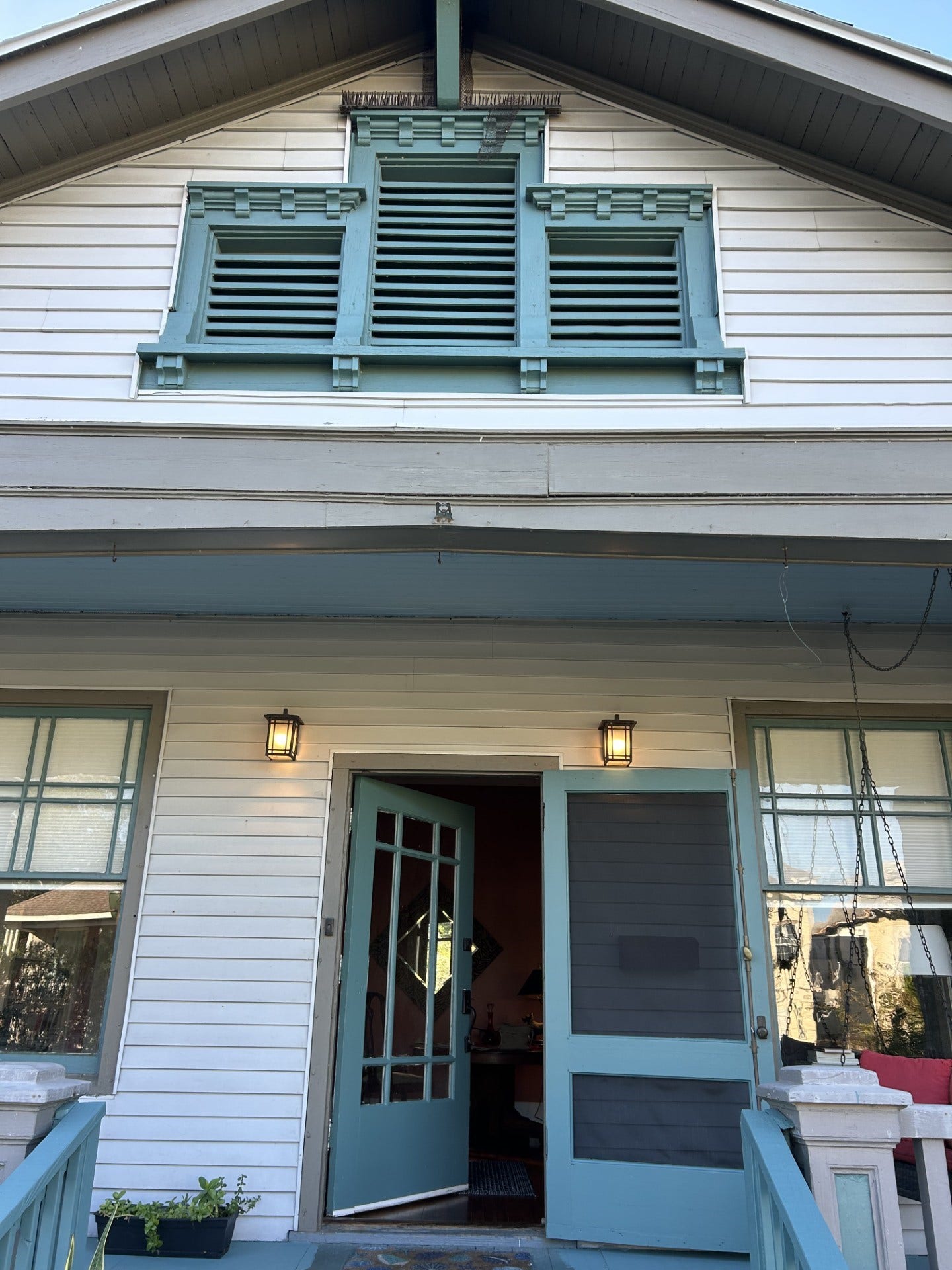 3911 Bernardo De Galvez Avenue, Galveston, TX 77550 Three attic vent windows in a craftsman-style.