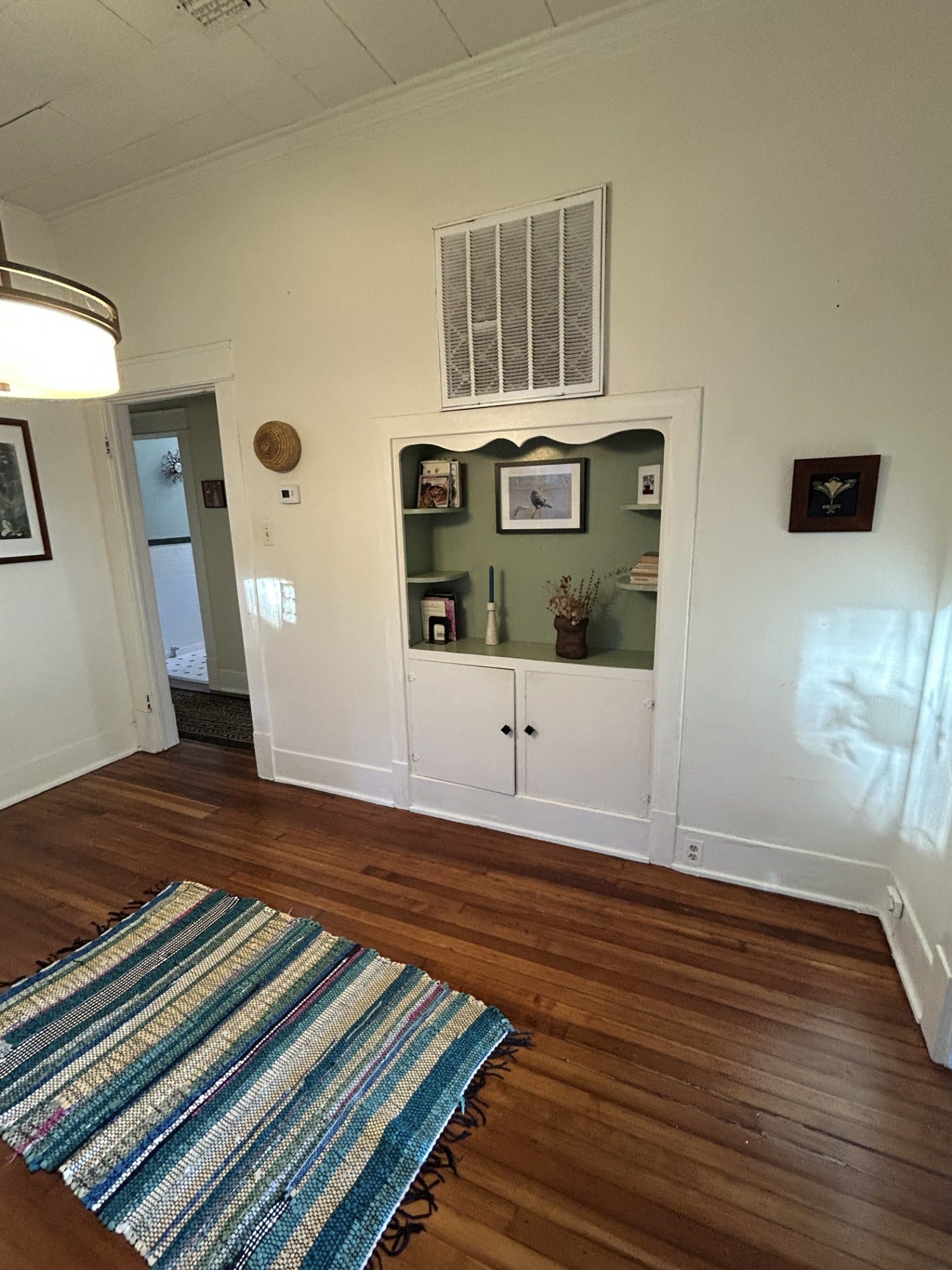 3911 Bernardo De Galvez Avenue, Galveston, TX 77550 Formal dining room with west hutch. Doorway to the left goes to the two bedrooms and full bath.