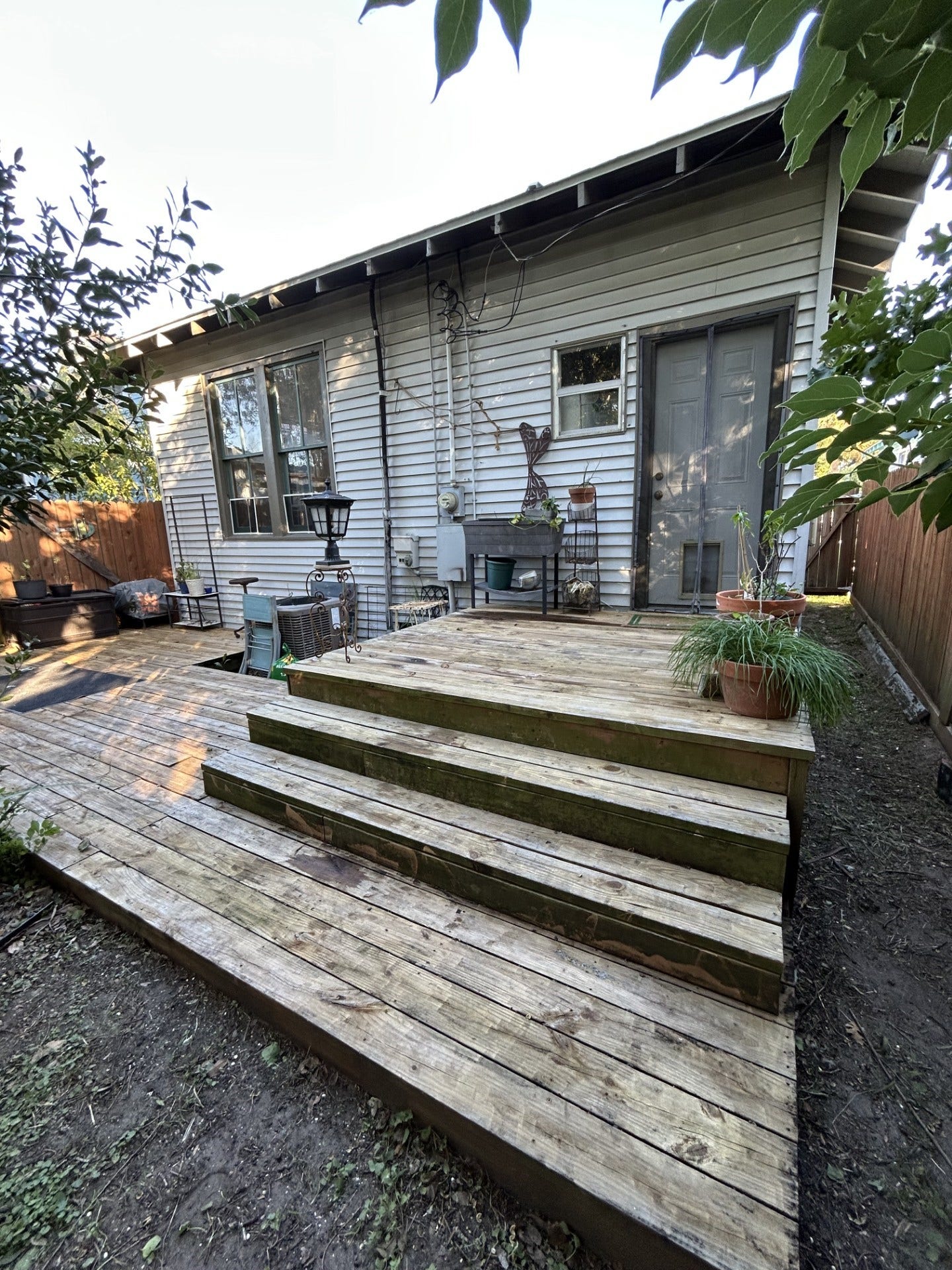 3911 Bernardo De Galvez Avenue, Galveston, TX 77550 Back of the house showing the steps and the layered back deck.