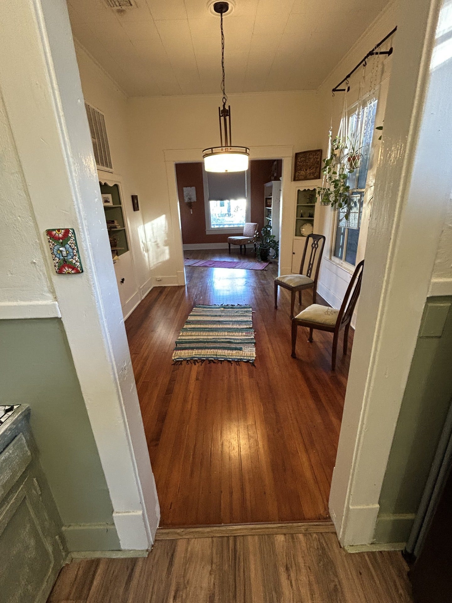 3911 Bernardo De Galvez Avenue, Galveston, TX 77550 Looking from the kitchen through the formal dining room with the living room in the background.
