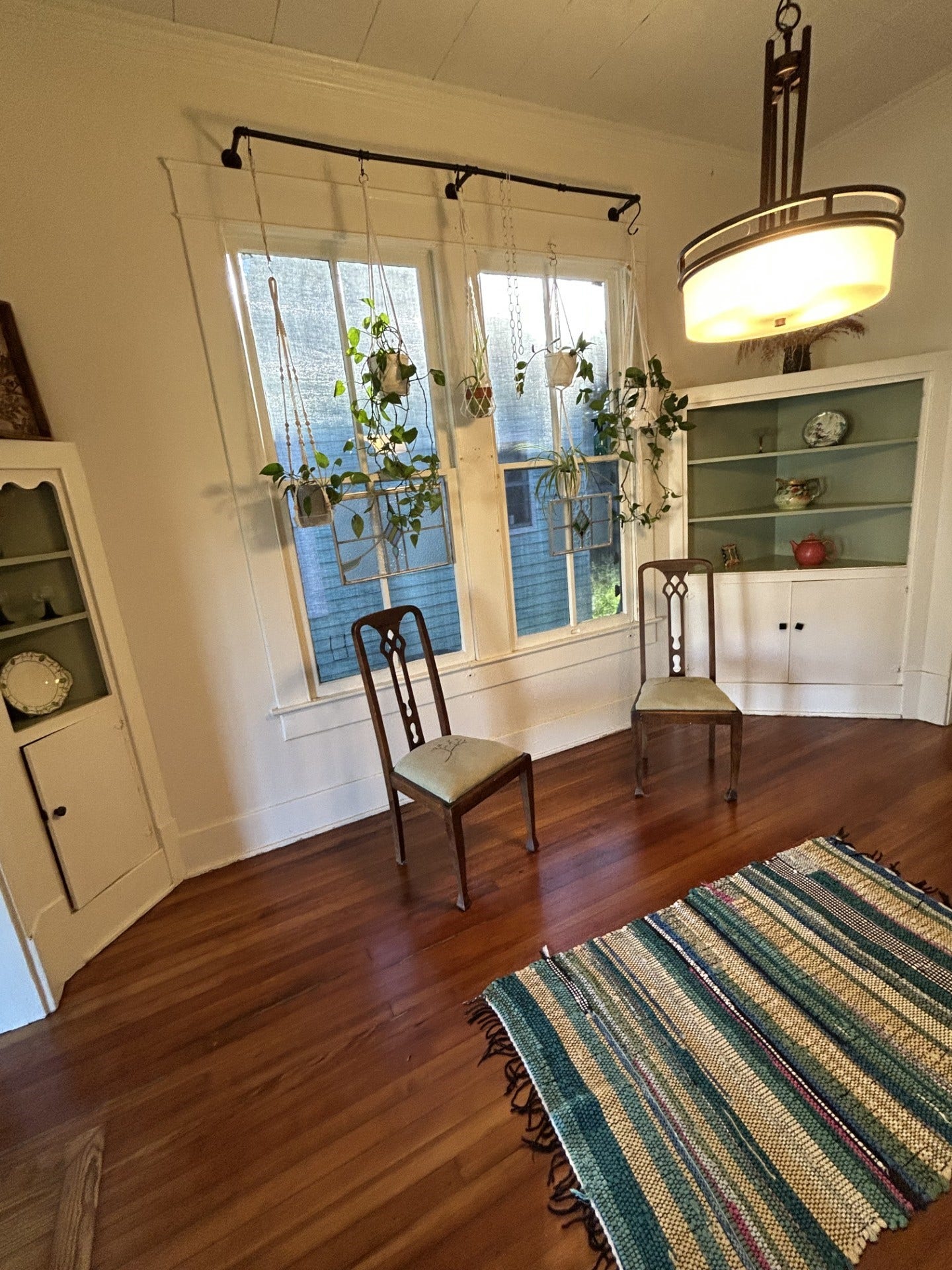 3911 Bernardo De Galvez Avenue, Galveston, TX 77550 Quartersawn longleaf antique pine floors in many room. The dining room has three hutches. The northeast hutch and the southeast hutch are pictured here. In the windows are the hurricane fabric for window protection.