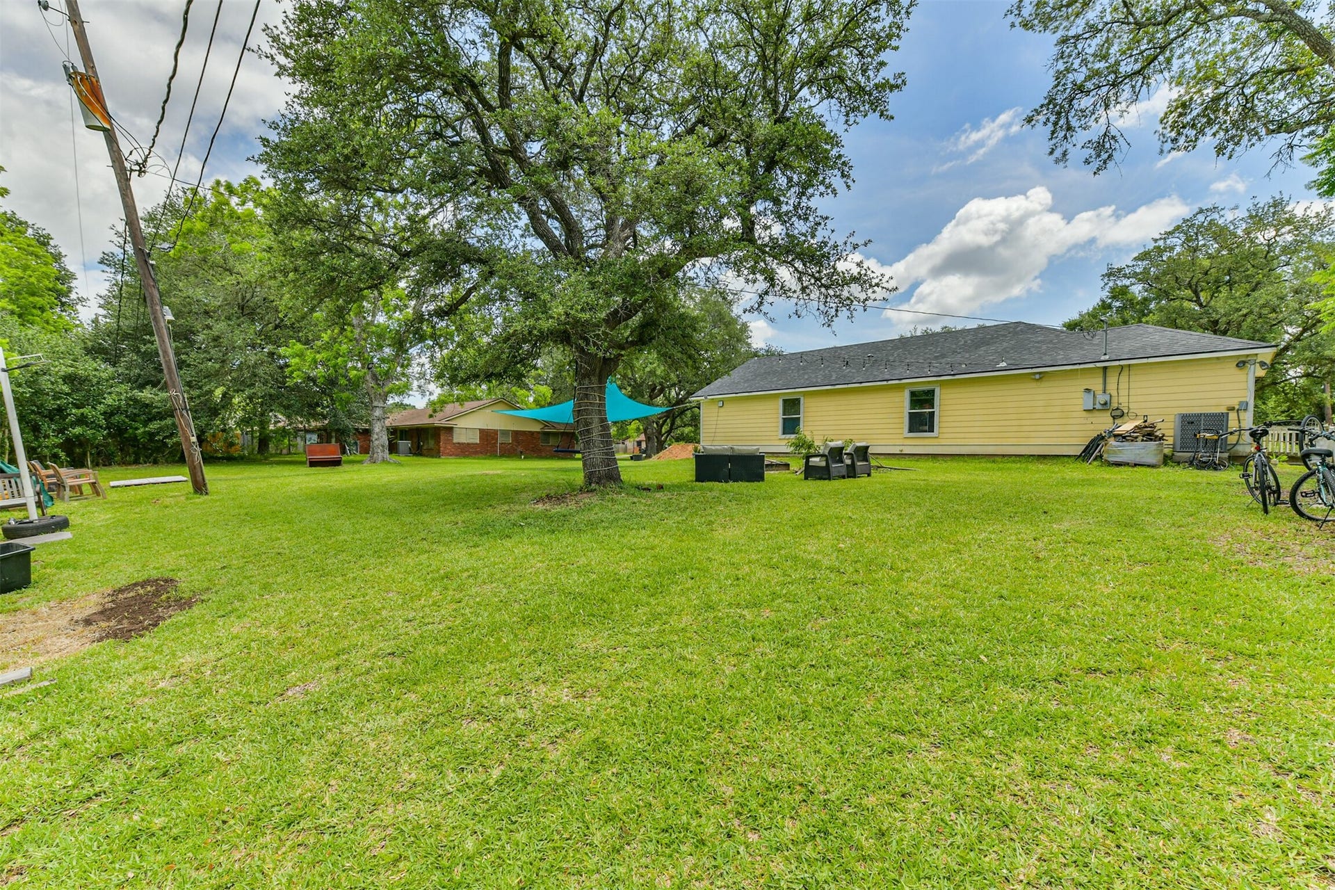 207 Oakridge Drive, Hitchcock, TX 77563 Plenty of space to design your own outdoor ideal gathering space.