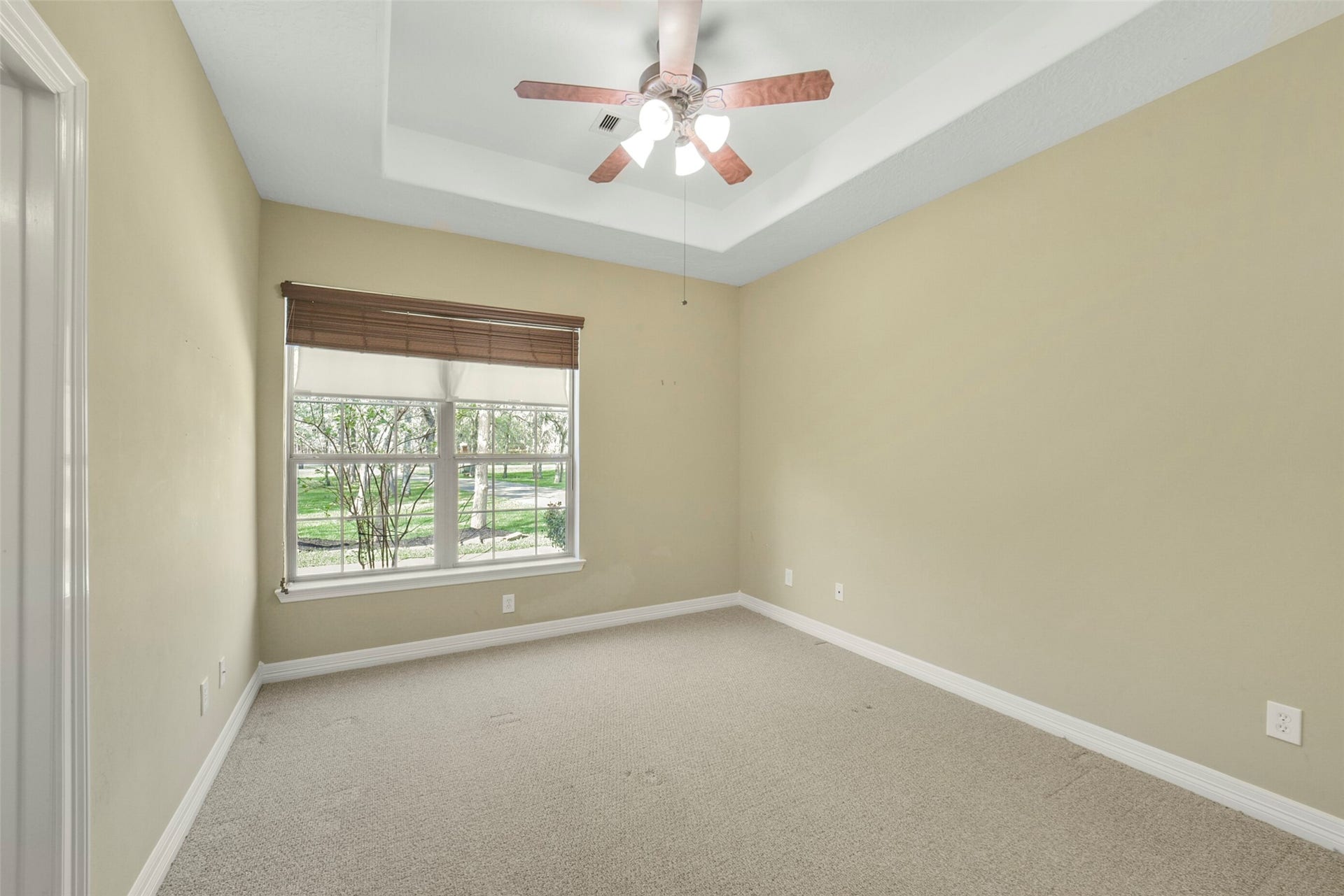 3522 Wellspring Lake Drive, Fulshear, TX 77441 Secondary Bedroom with Tray Ceiling and View to Front Yard.