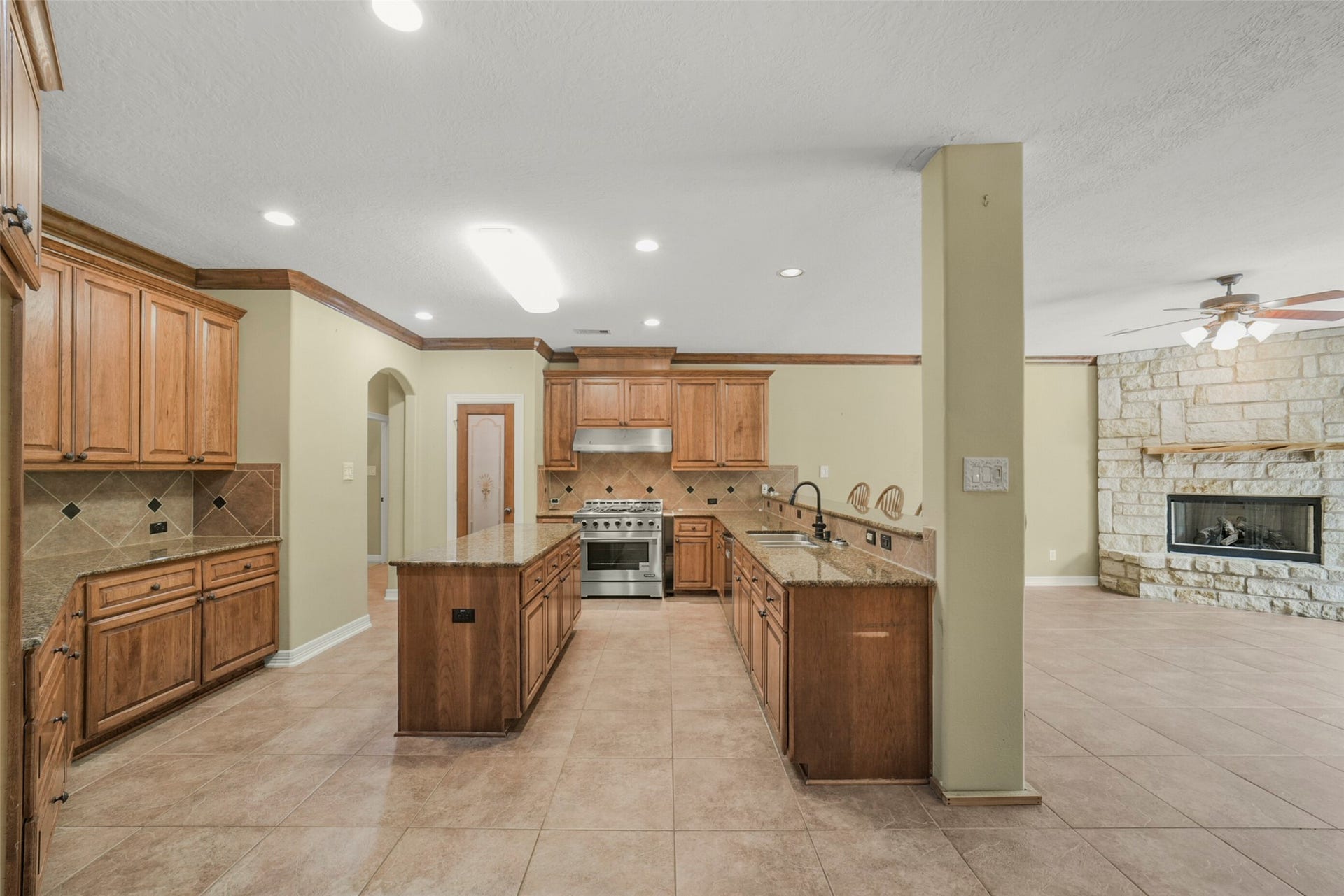 3522 Wellspring Lake Drive, Fulshear, TX 77441 Wonderful Roomy Kitchen with large Island, Walk-in Pantry and Ample Counter Space and Storage Cabinets for any Entertainer!
