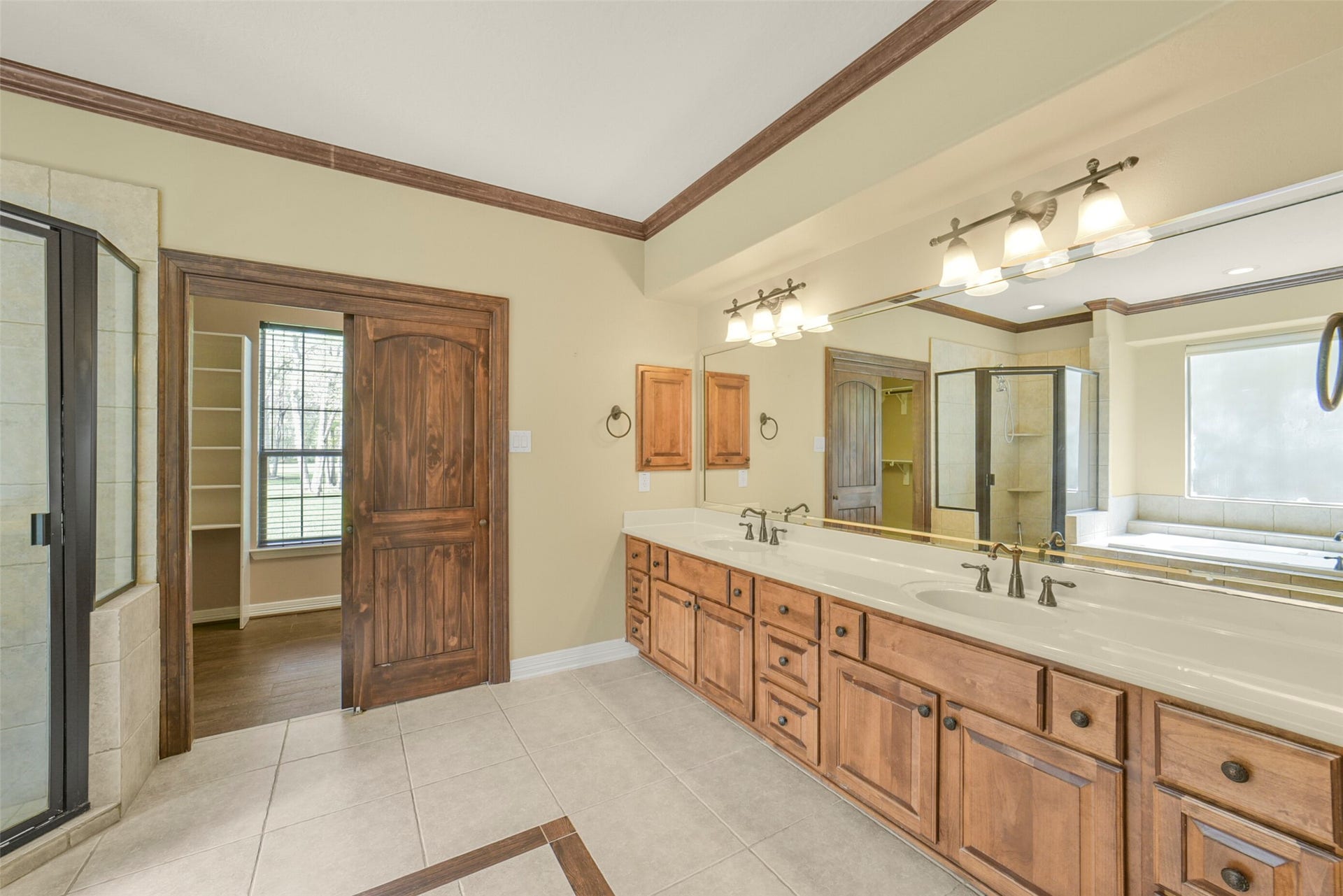 3522 Wellspring Lake Drive, Fulshear, TX 77441 Primary bath with His and Hers sinks, shower, jetted soaking tub and Huge walk-in Closet!