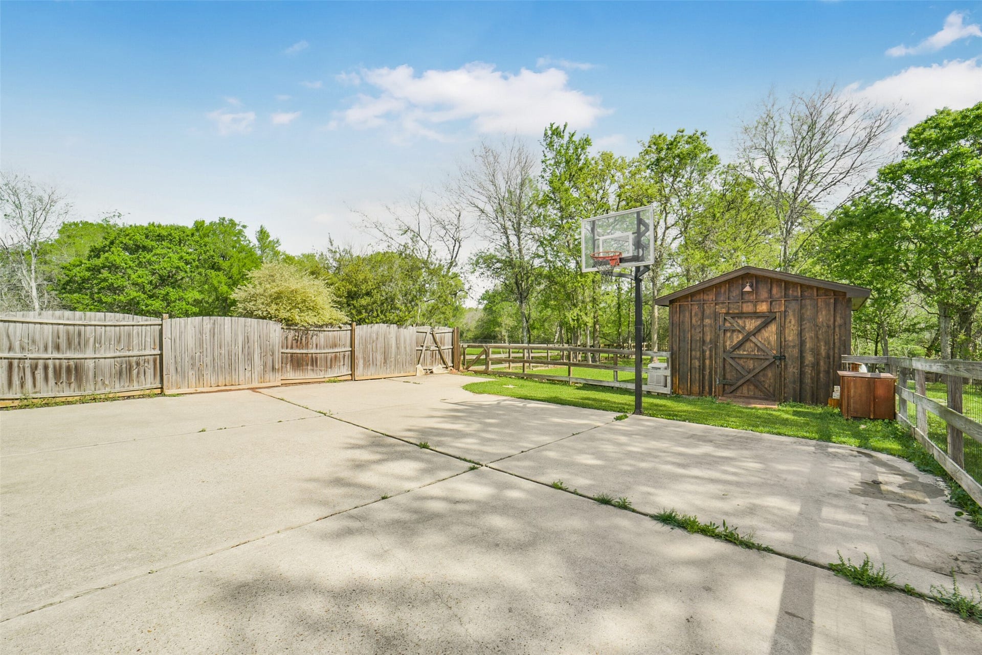 3522 Wellspring Lake Drive, Fulshear, TX 77441 Plenty of Space for your own small Basketball Court with In Ground Goal! Along with a view of the Shed, also used for Extra Parking!