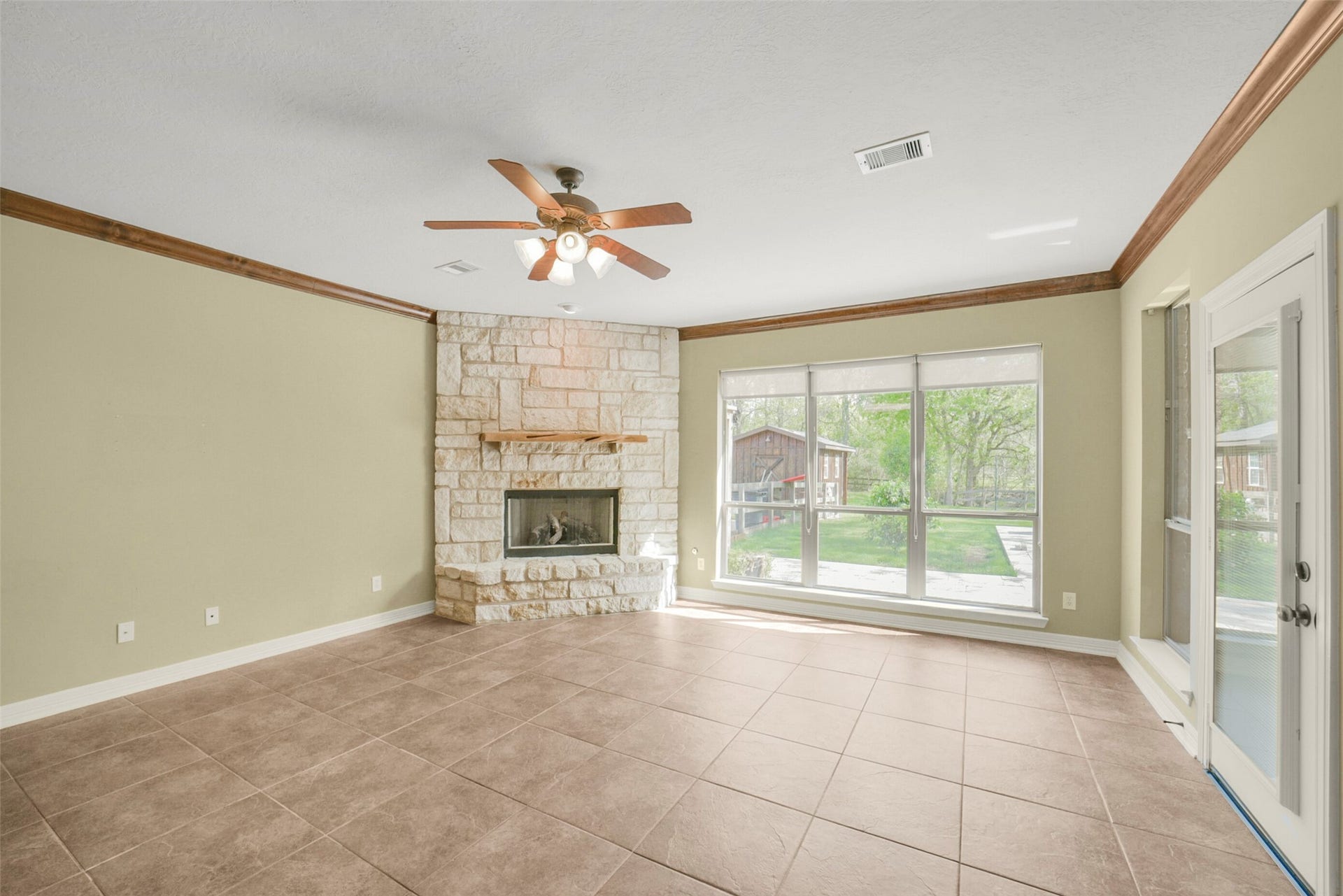 3522 Wellspring Lake Drive, Fulshear, TX 77441 Wide open Family room with Limestone Fireplace, Plenty of Natural Light to enjoy the stunning Back Yard views.