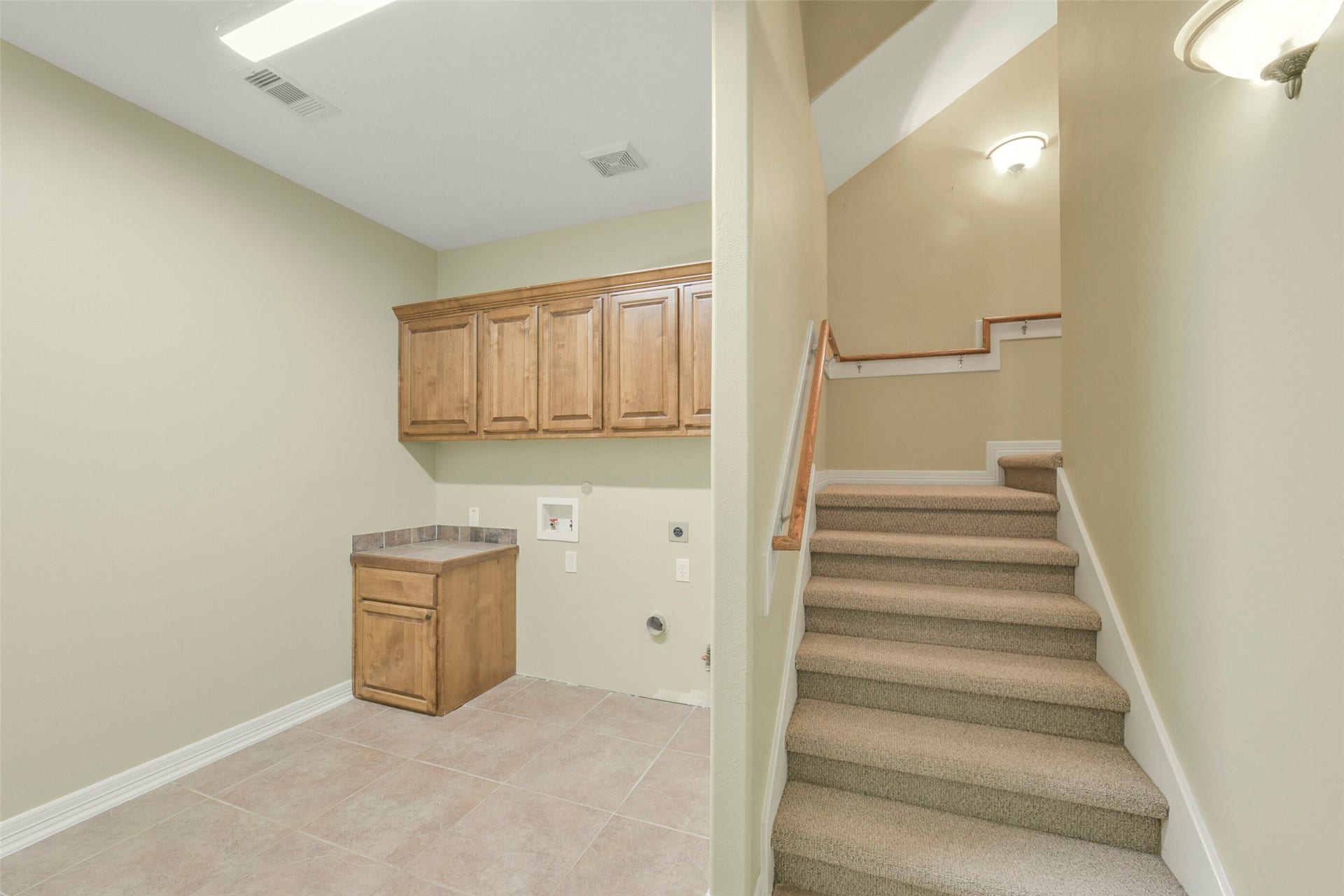 3522 Wellspring Lake Drive, Fulshear, TX 77441 Utility Room right when you enter from Garage, with Staircase leading to Media/Game Room