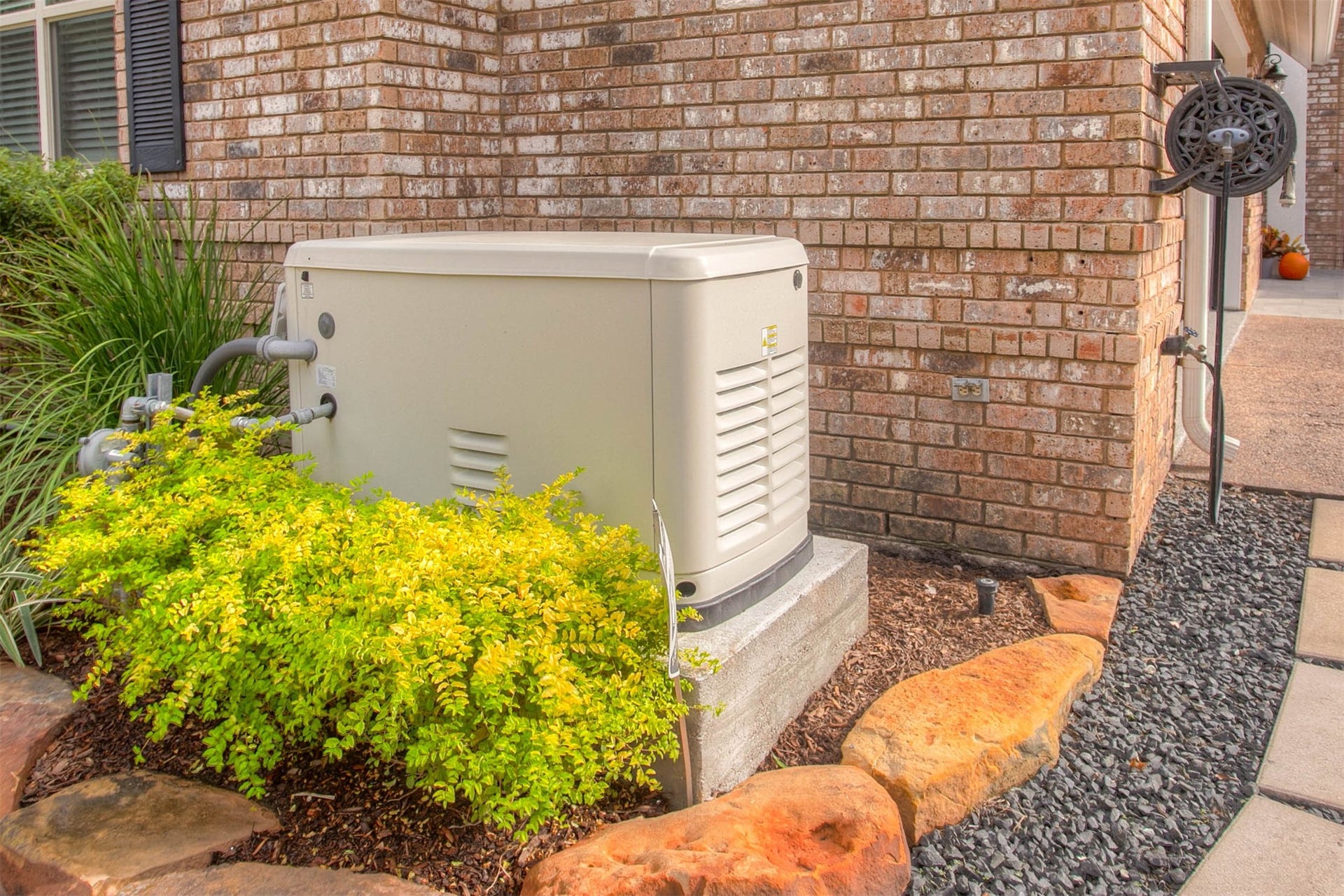12092 Sagittarius Drive E, Willis, TX 77318 Stay prepared for any power outage with a reliable Generac generator, seamlessly integrated into the home's exterior design.