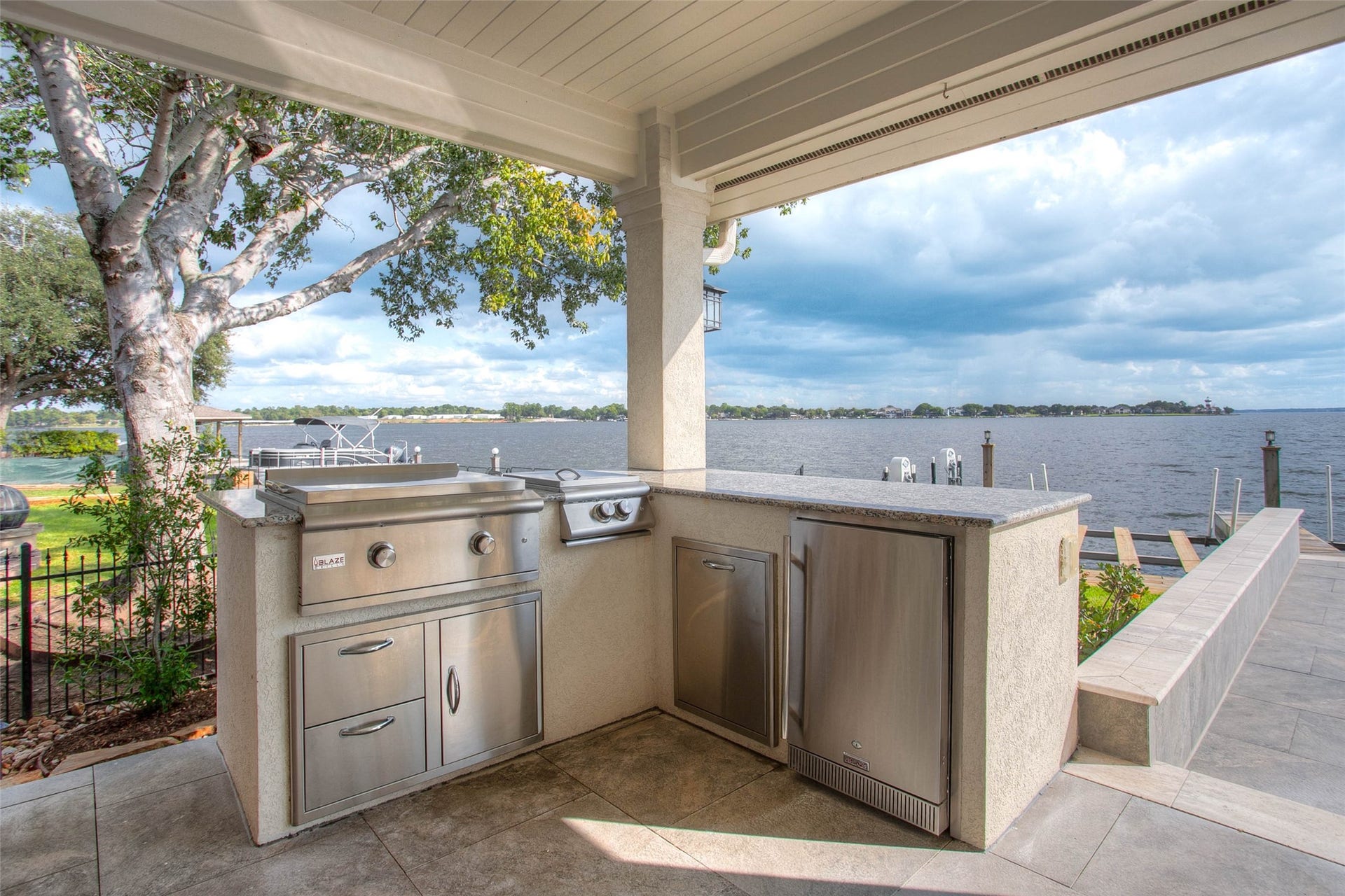 12092 Sagittarius Drive E, Willis, TX 77318 enjoy your friends with outdoor entertaining.