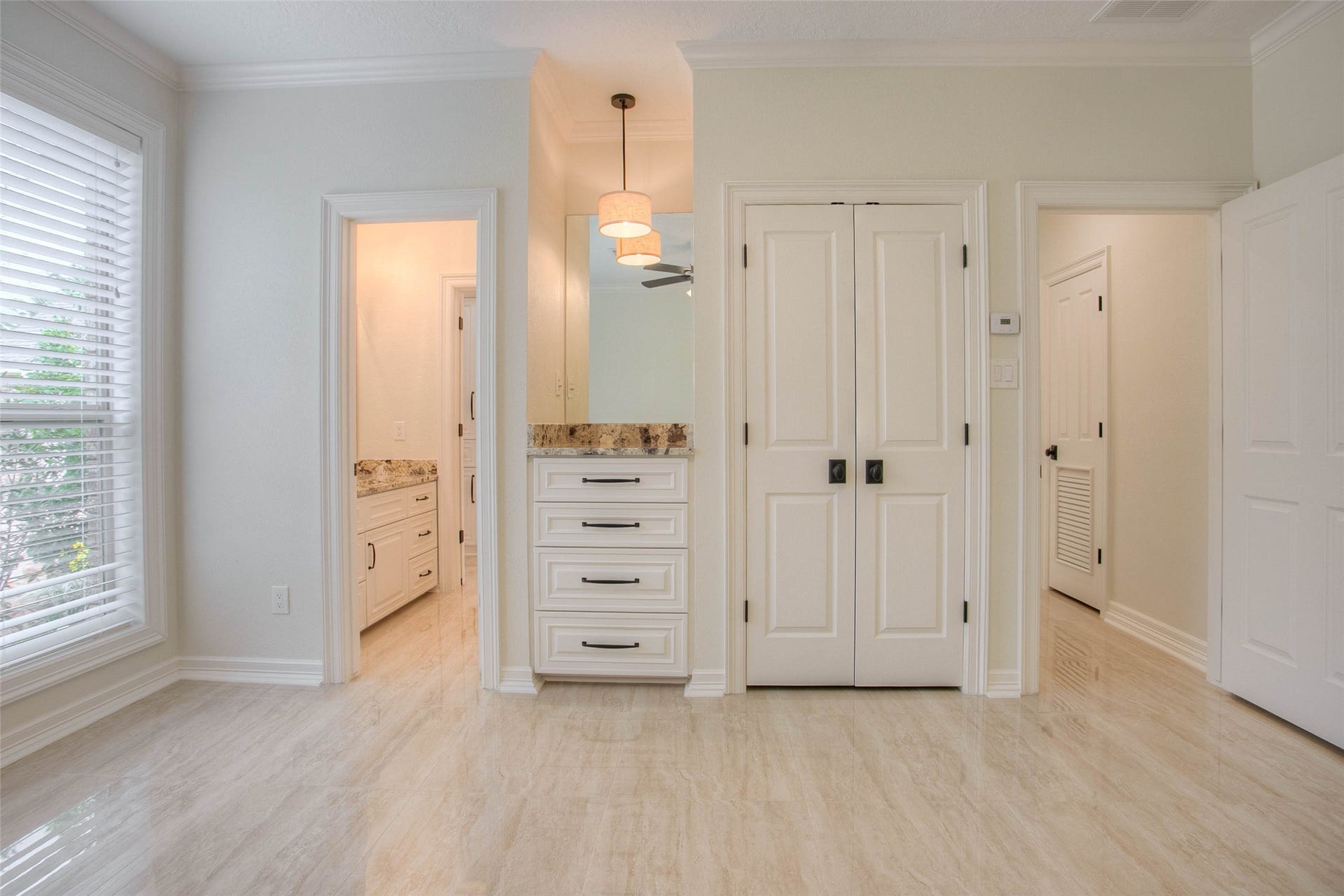 12092 Sagittarius Drive E, Willis, TX 77318 Experience comfort and style in this guest bedroom featuring elegant built-ins for ample storage and functionality.