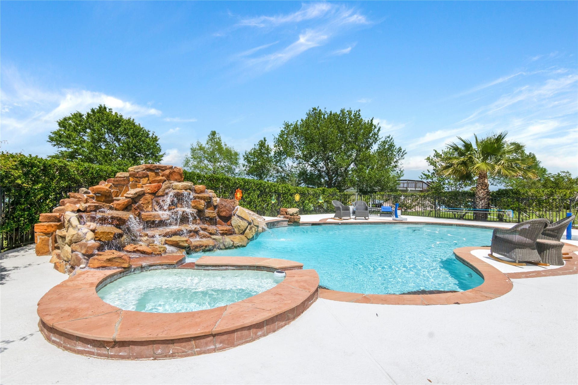 143 Lago Circle Drive N, Santa Fe, TX 77517 Resort Style pool with hot tub and waterfall