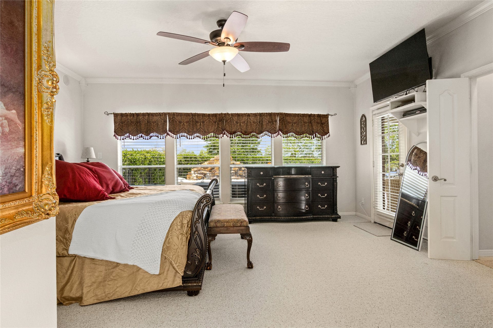 143 Lago Circle Drive N, Santa Fe, TX 77517 Primary Bedroom large windows overlooking pool