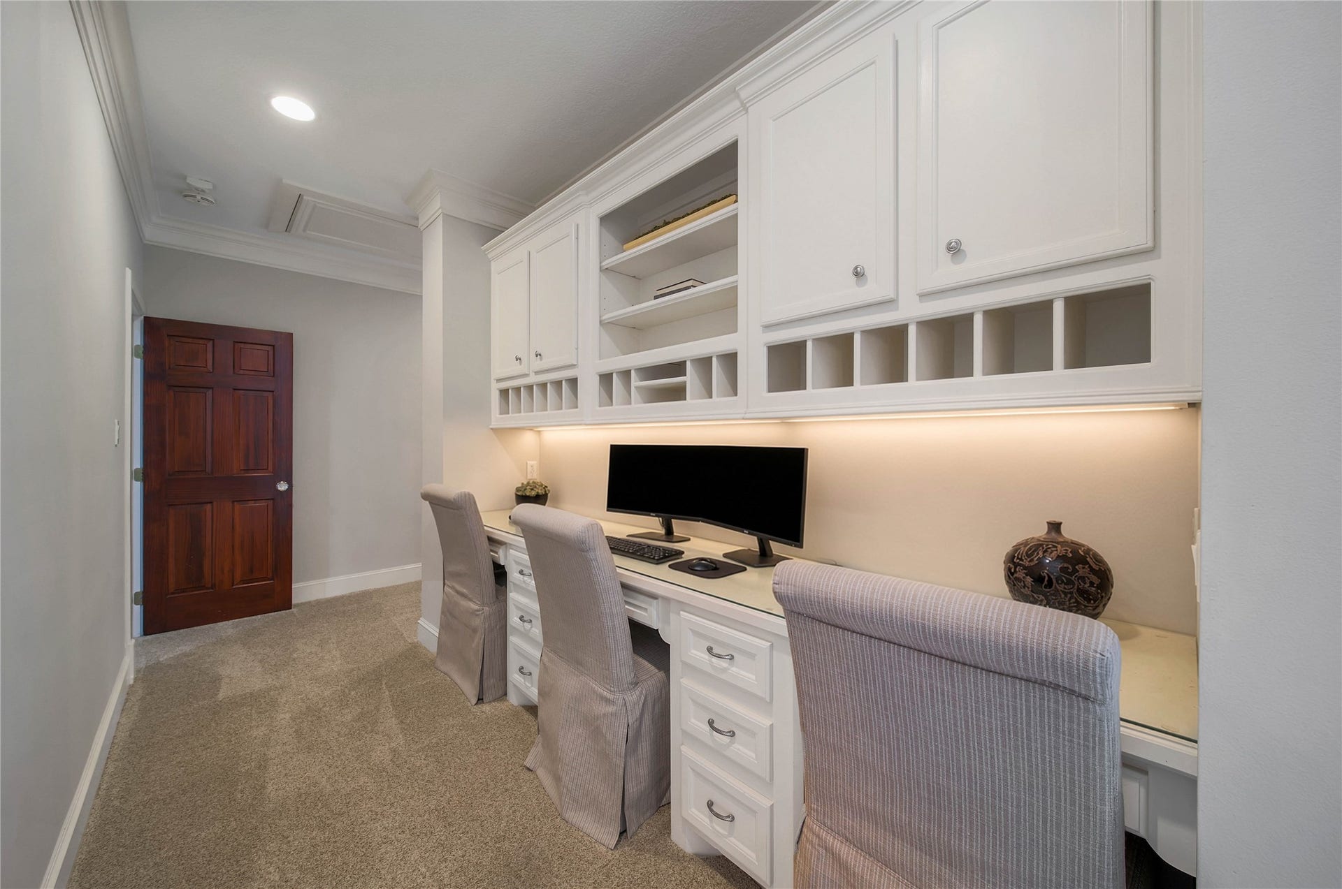 12635 Hunters Canyon Lane, Cypress, TX 77429 Upstairs computer station located in the hallway with built-in cabinetry, ample storage, and a cozy multiple person workspace.
