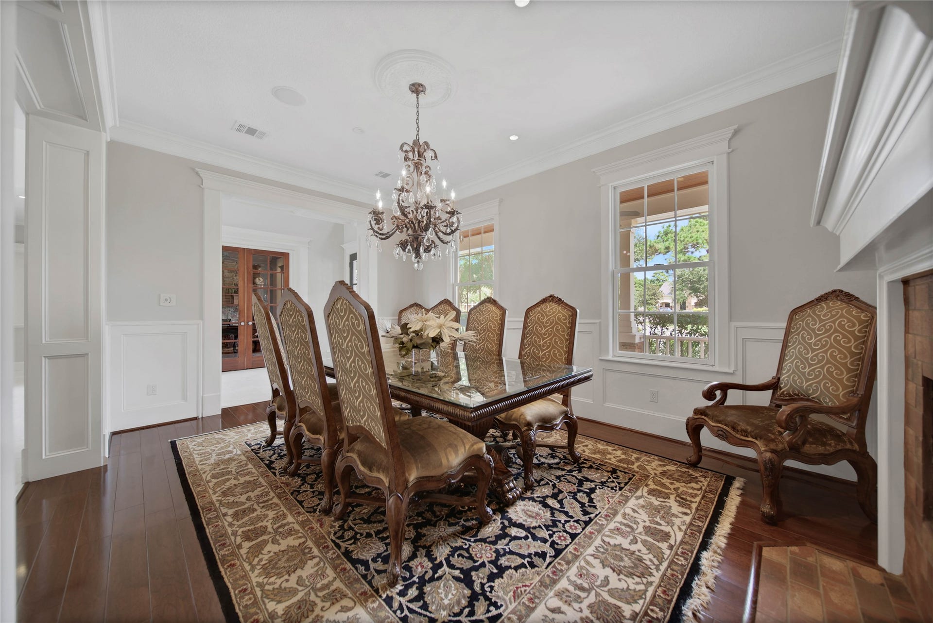 12635 Hunters Canyon Lane, Cypress, TX 77429 The room has a beautiful chandelier with crystals hanging from a medallion on the ceiling. The custom millwork in this home is exceptional.