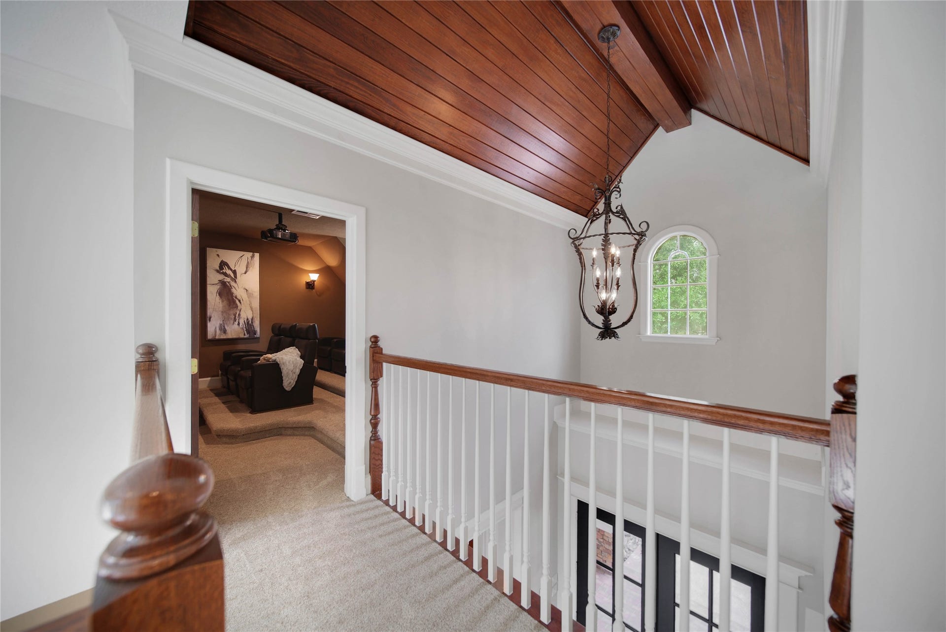 12635 Hunters Canyon Lane, Cypress, TX 77429 Check out the entry, and stair well is vaulted with a tongue and groove ceiling and stylish chandelier, leading to a cozy media room. The dormer window is another accent adding to the custom feel when you enter the home.