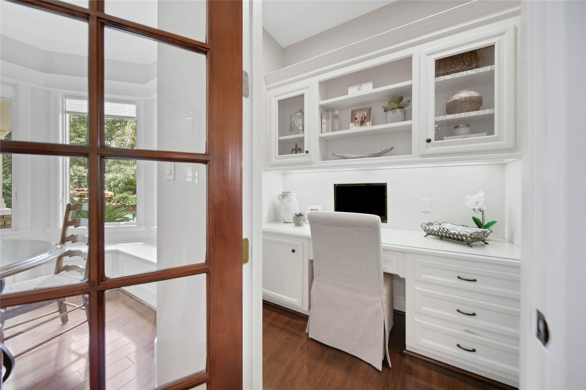 12635 Hunters Canyon Lane, Cypress, TX 77429 An additional home office with built-in white cabinetry, is the perfect space for the home manager. This room is tucked away behind a French door in the gathering area of the home.