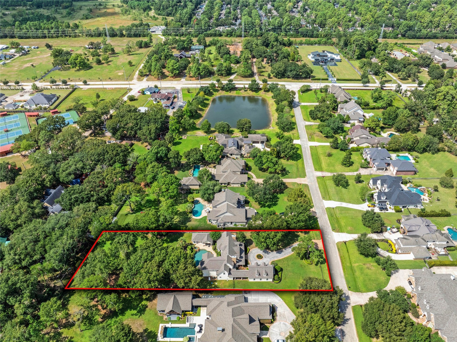 12635 Hunters Canyon Lane, Cypress, TX 77429 Nestled in a lush, tree-lined enclave of 18 homes, this expansive property offers a serene escape with a generous lot highlighted by its verdant surroundings. Enjoy the tranquil setting with easy access to nearby amenities and picturesque views of the community pond.
