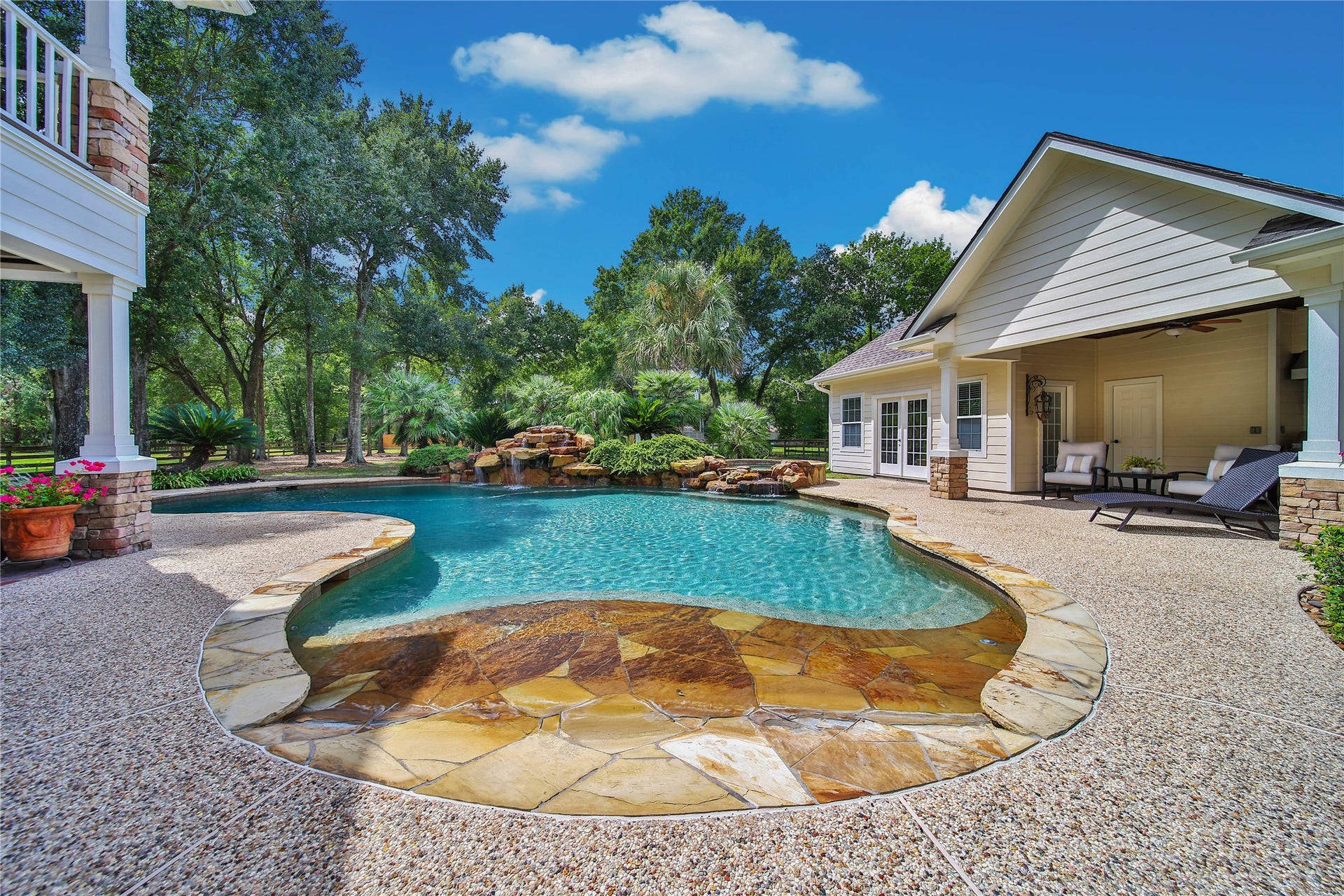 12635 Hunters Canyon Lane, Cypress, TX 77429 Stunning backyard oasis with a sparkling pool, natural stone accents, a beach entry and ten foot deep end. Beyond the pool area is the large backyard with plenty of room for other activities.