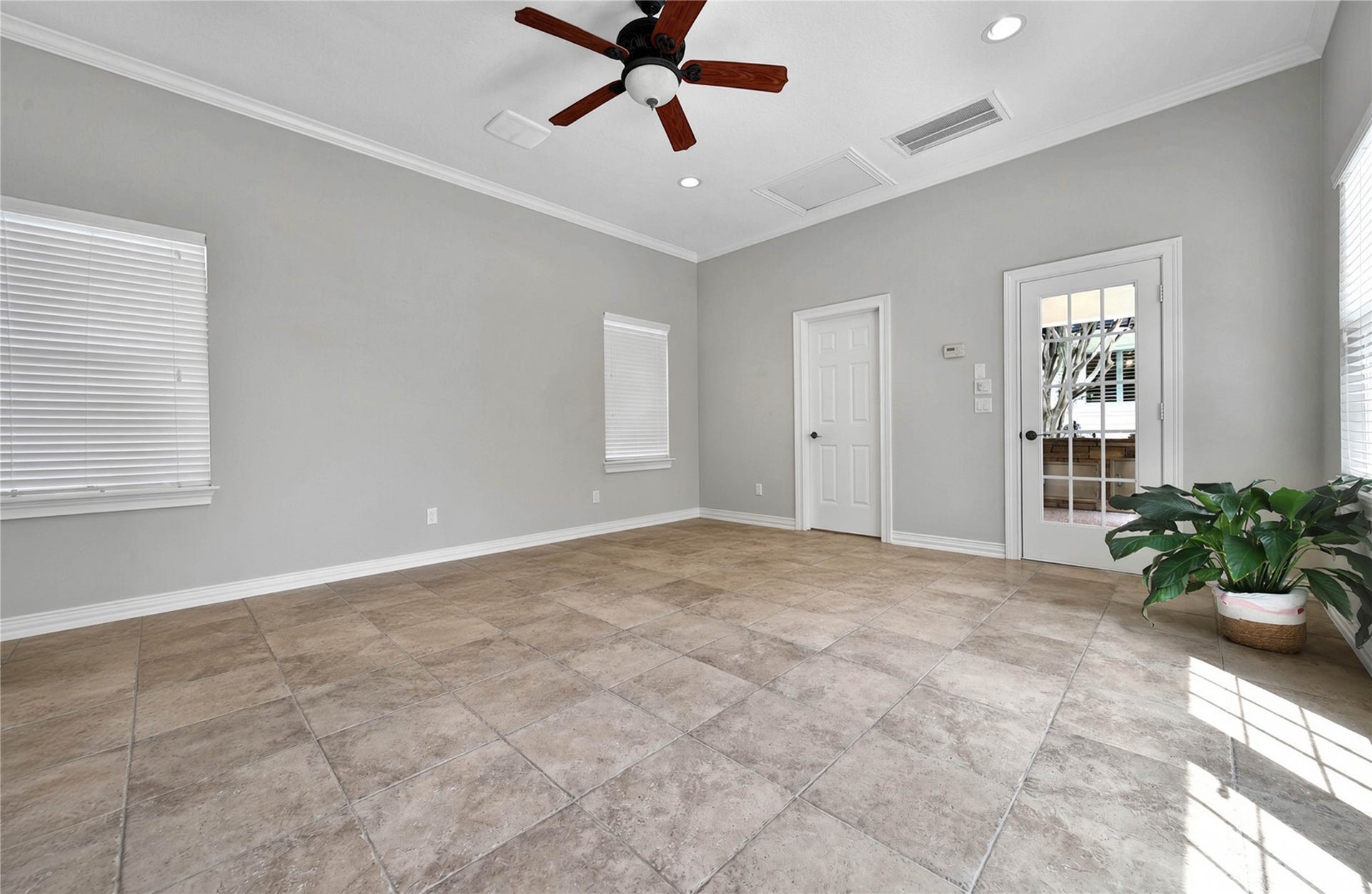 12635 Hunters Canyon Lane, Cypress, TX 77429 The pool house has approximately 450 square feet and features this spacious room with large tiles, neutral walls, and abundant natural light, featuring a ceiling fan and French door access. There is a full bath so this room has endless possibilities.