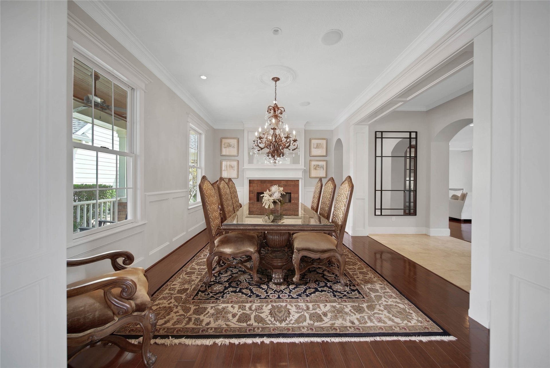 12635 Hunters Canyon Lane, Cypress, TX 77429 The elegant dining room is to the left as you enter the home and features raised wainscoting panels and paneled cased openings. There is a brick gas fireplace that adds to the charm of this room along with convenient access to the kitchen.