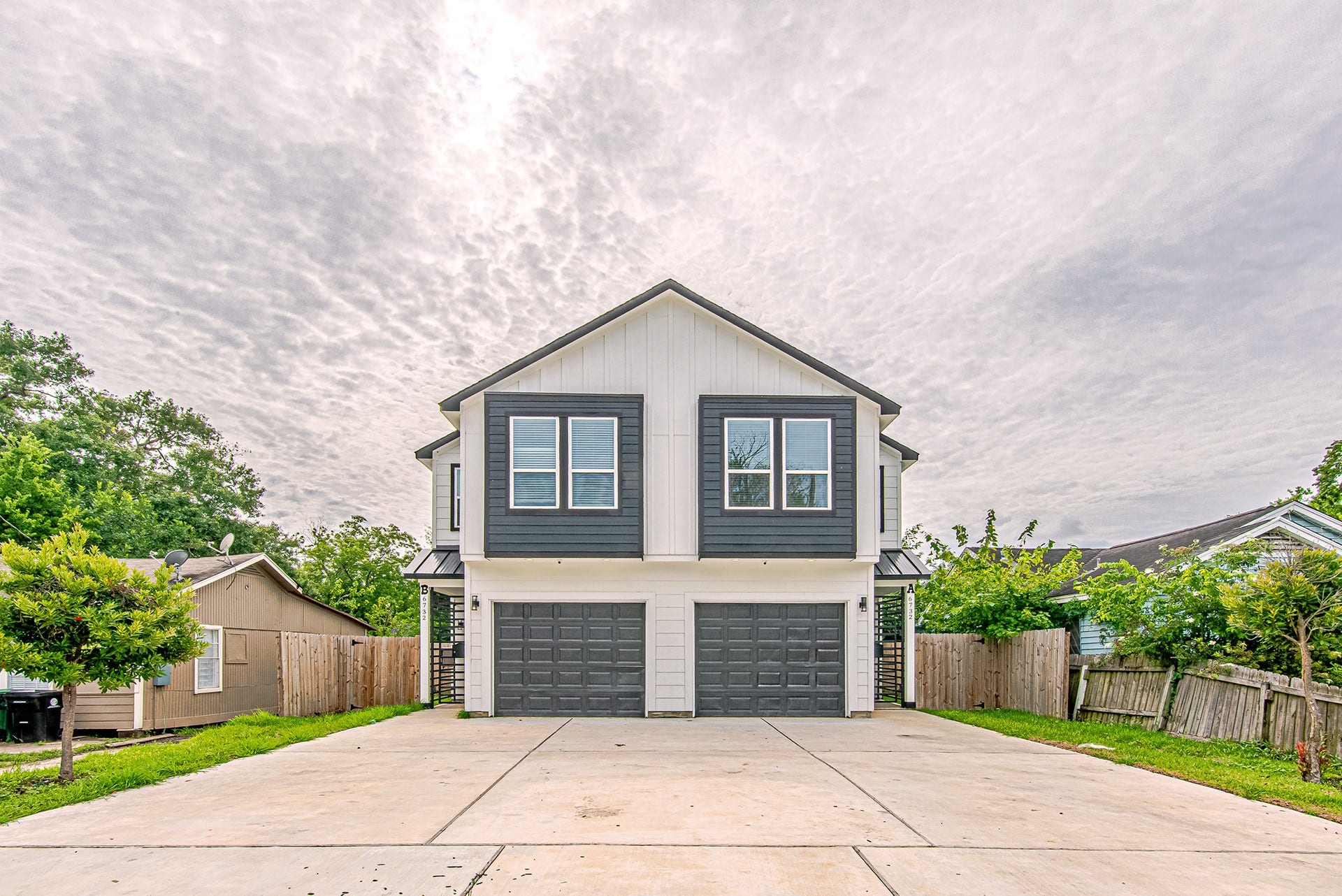 Front exterior showcasing contemporary architecture, a private driveway, and attractive curb appeal.