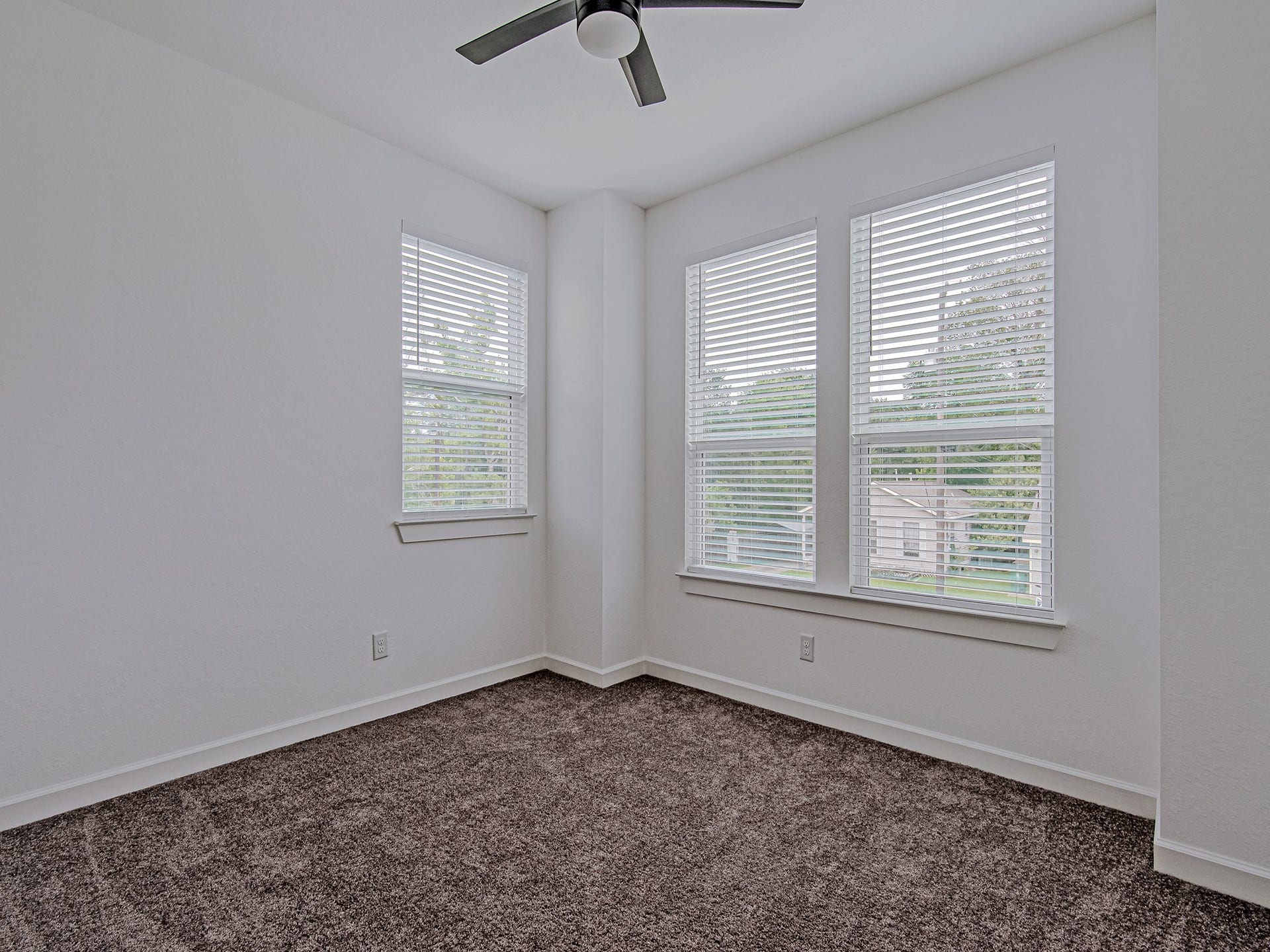 Well-sized bedroom offering natural light, comfortable living space, and versatile use.